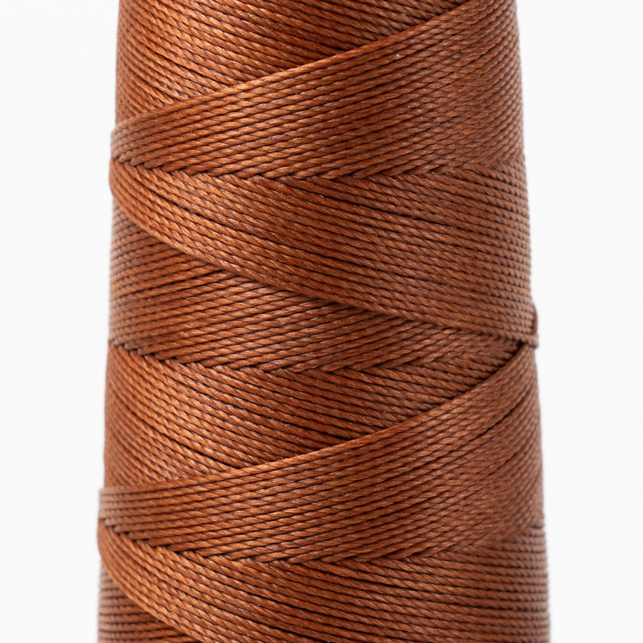Close-up of MBT brown waxed polyester thread