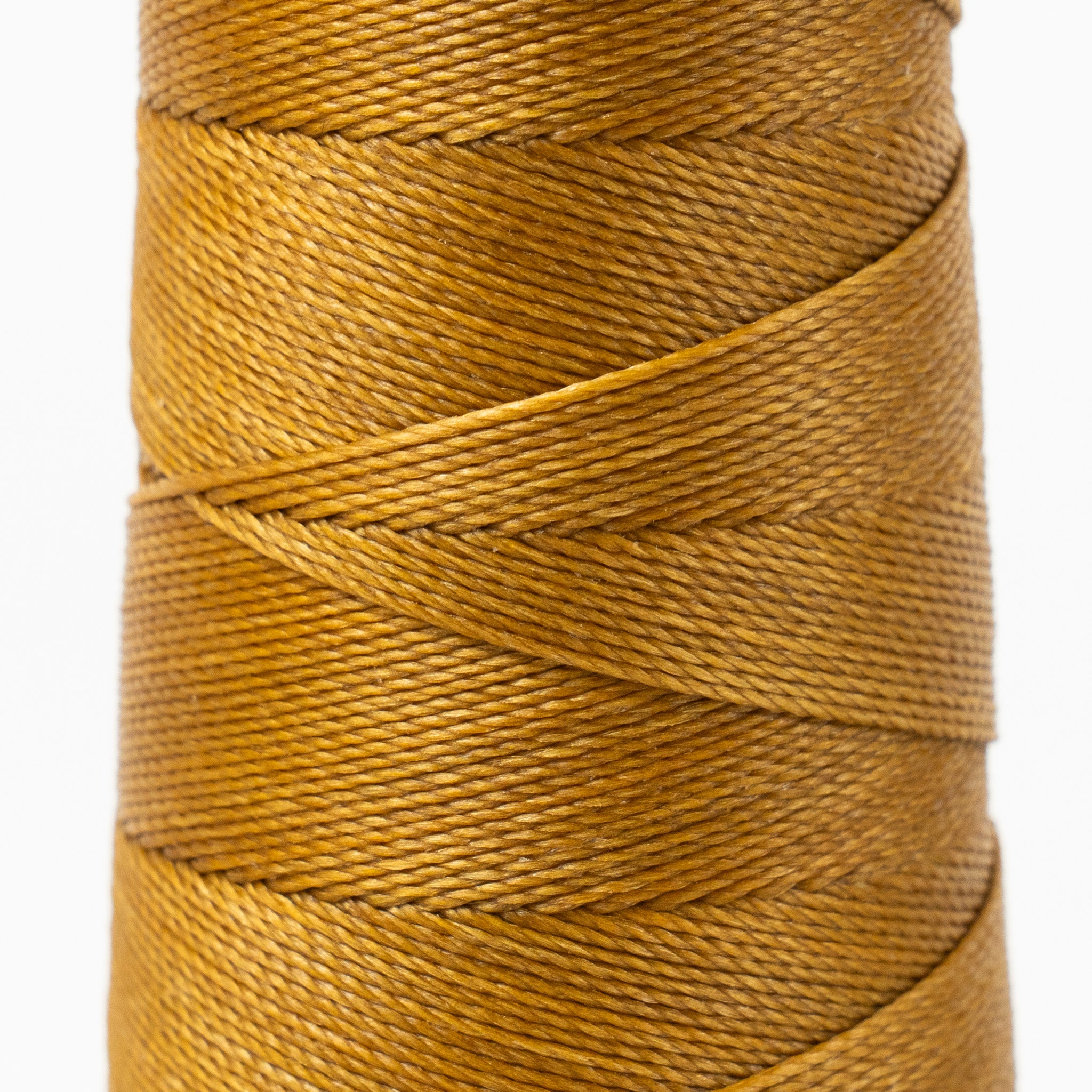 Close-up of MBT fawn waxed polyester thread