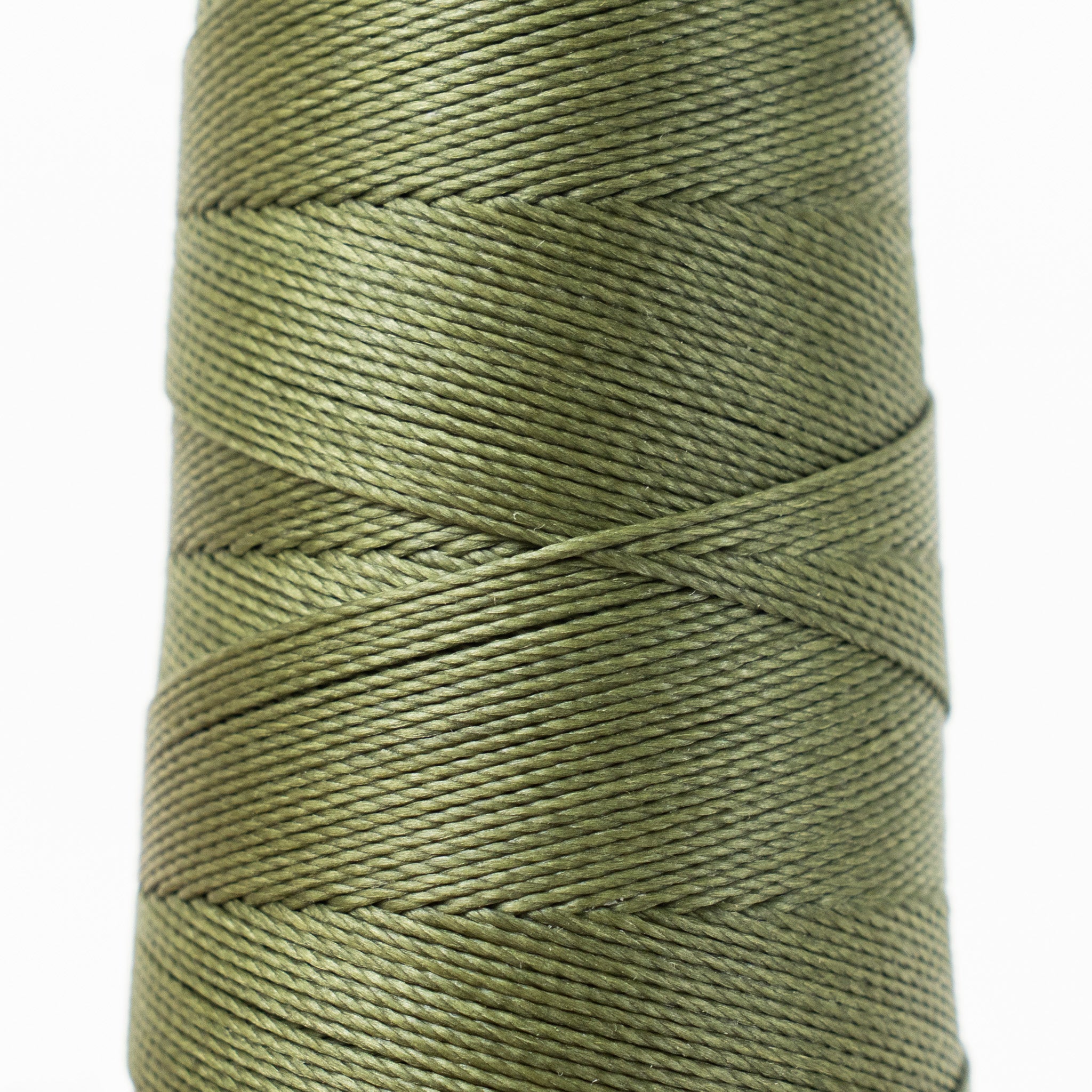 Close-up of MBT heart gold olive waxed polyester thread