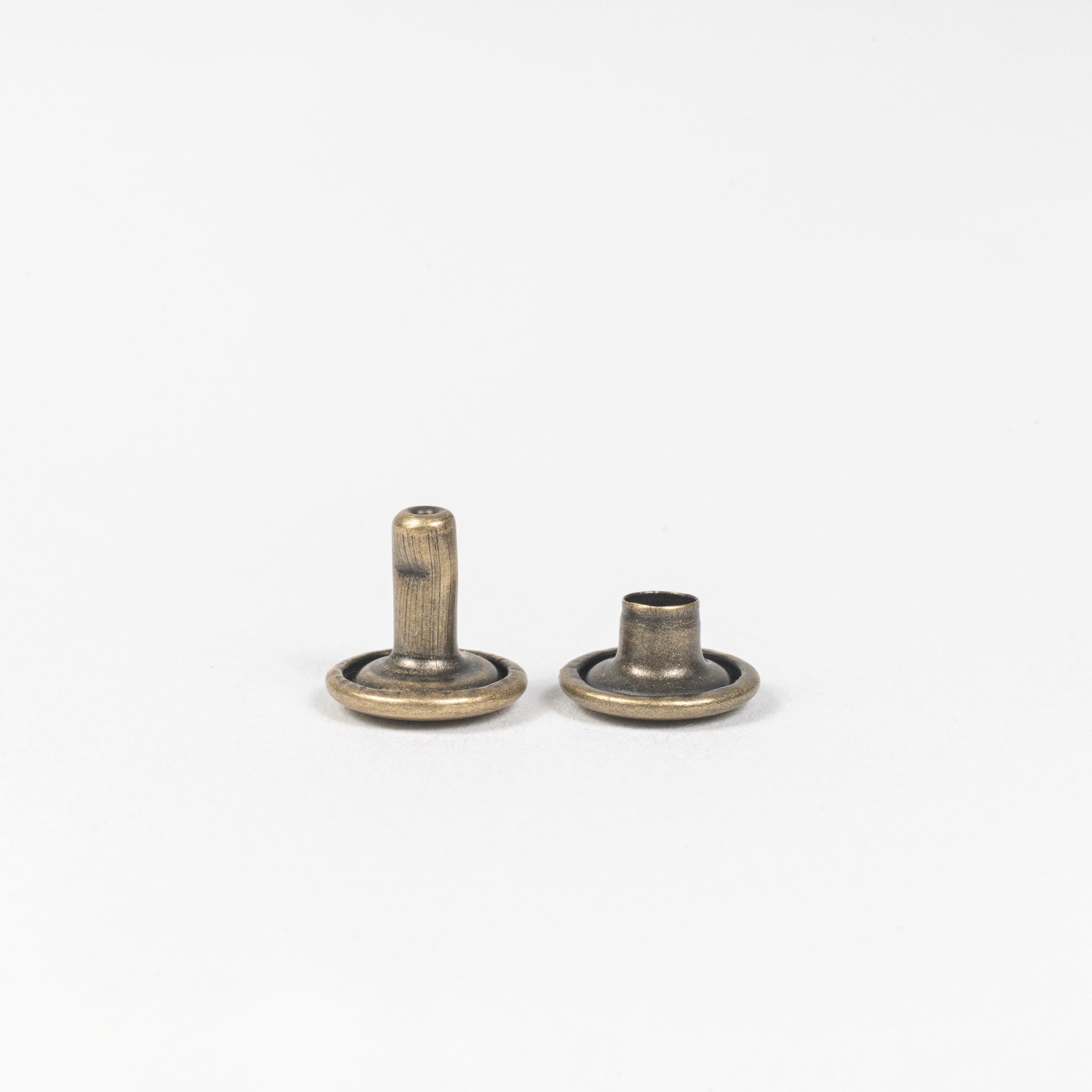 antique brass double cap rivet post view