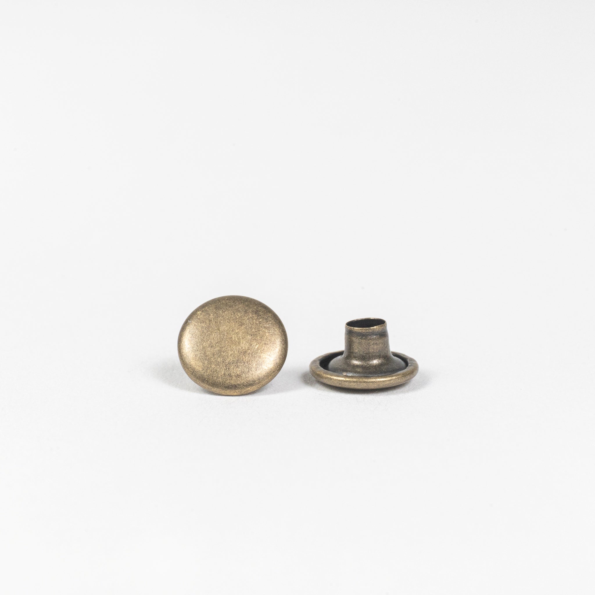 antique brass double cap rivets top and base view