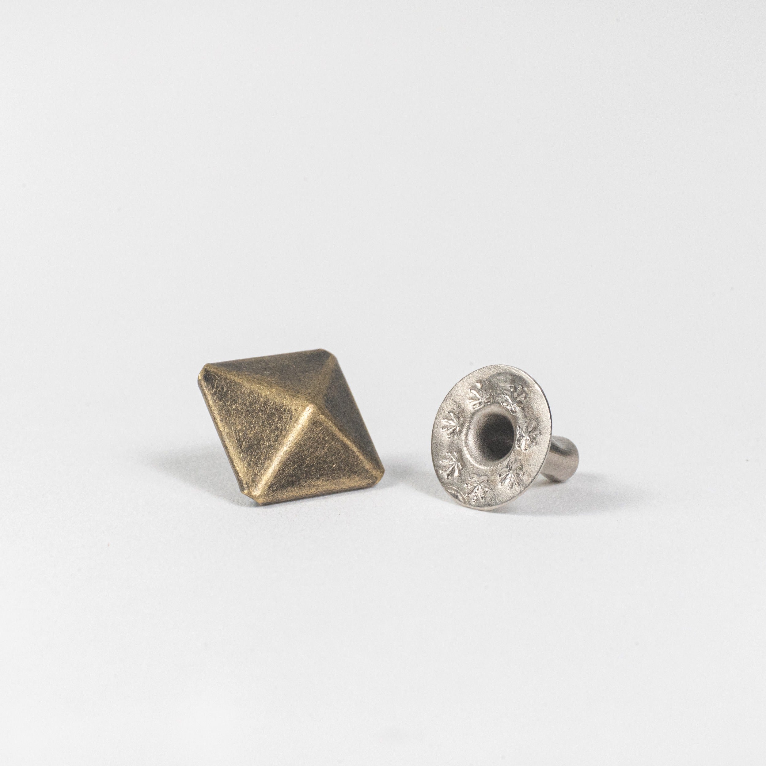 antique brass pyramid rivet angle view