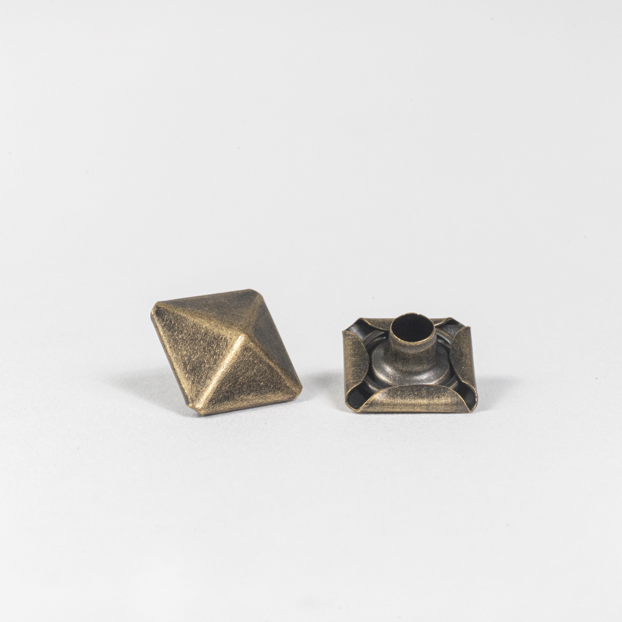 antique brass pyramid rivet cap front view