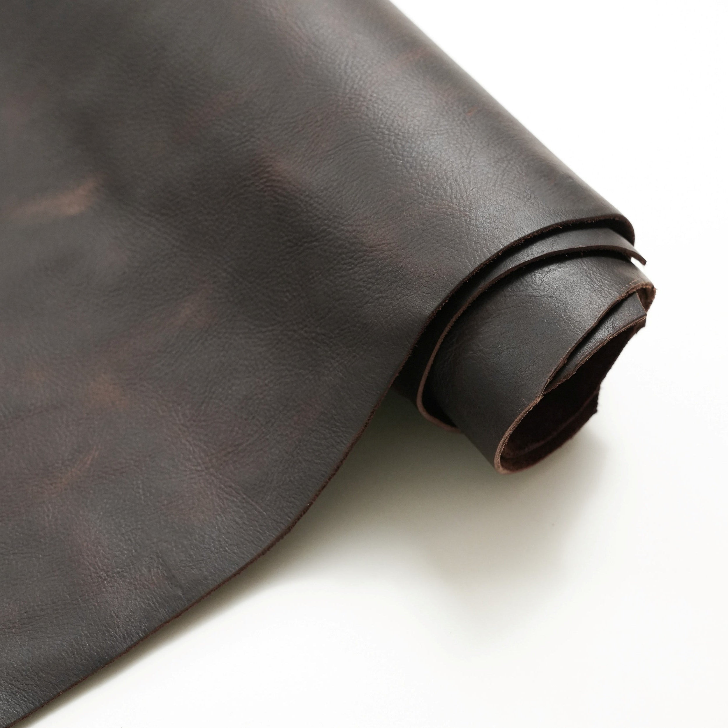 brown full grain pull up leather partially unrolled view