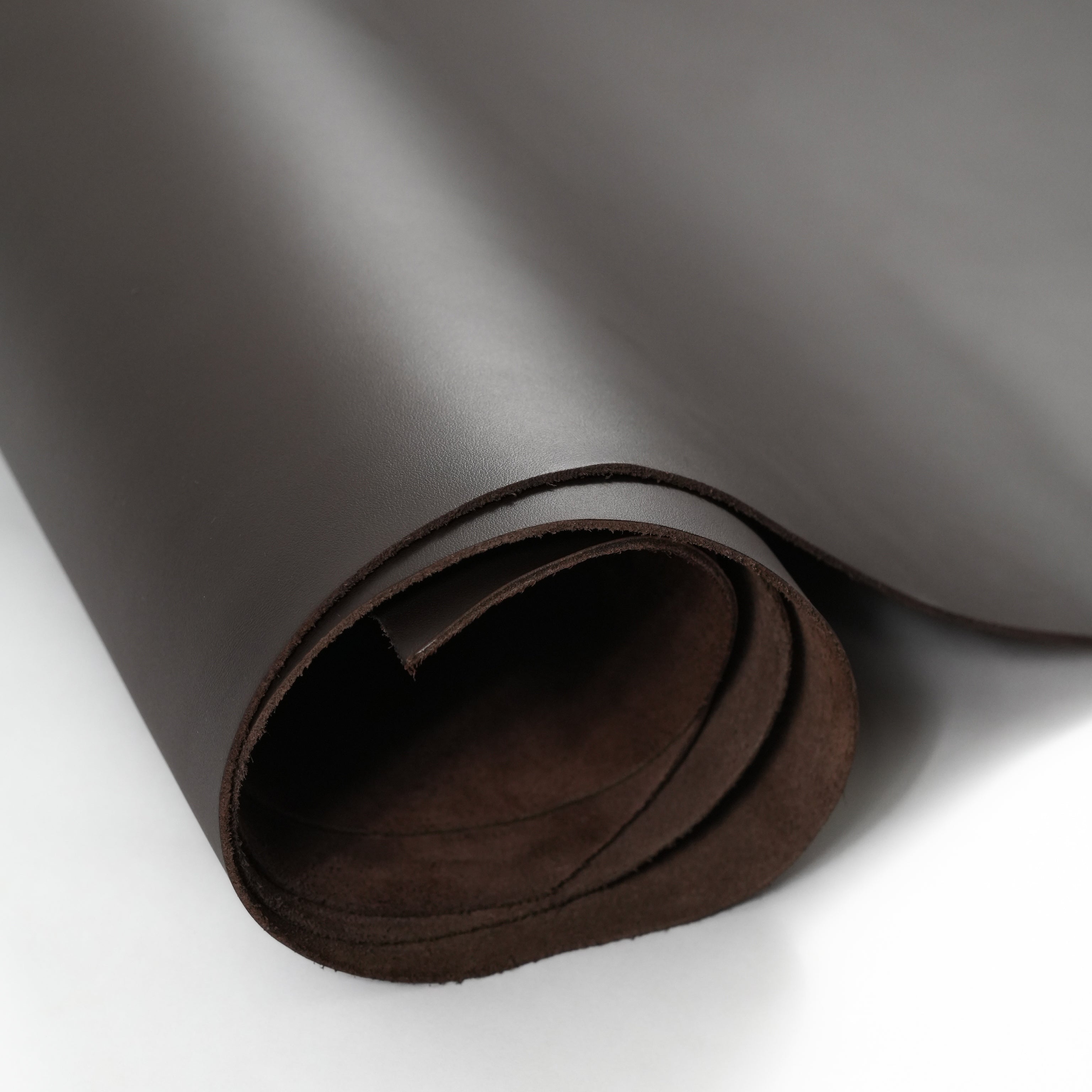 Brown top-grain premium italian leather hide partially unrolled view