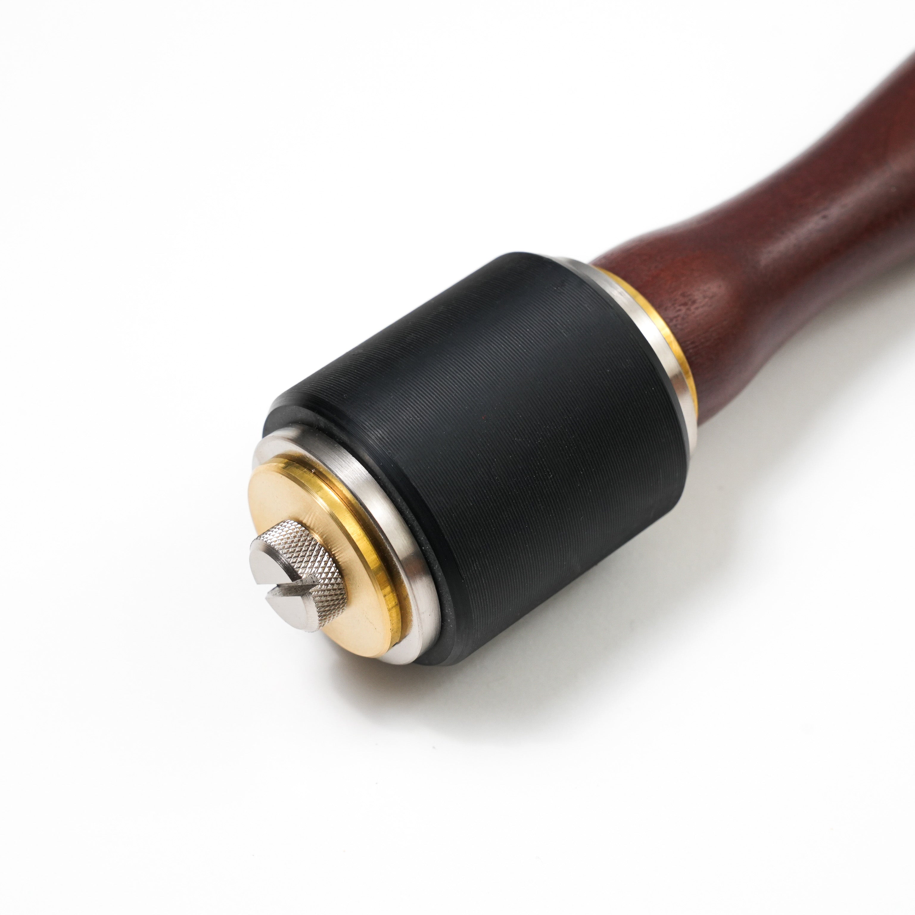 brown round maul black head close up leather craft tool