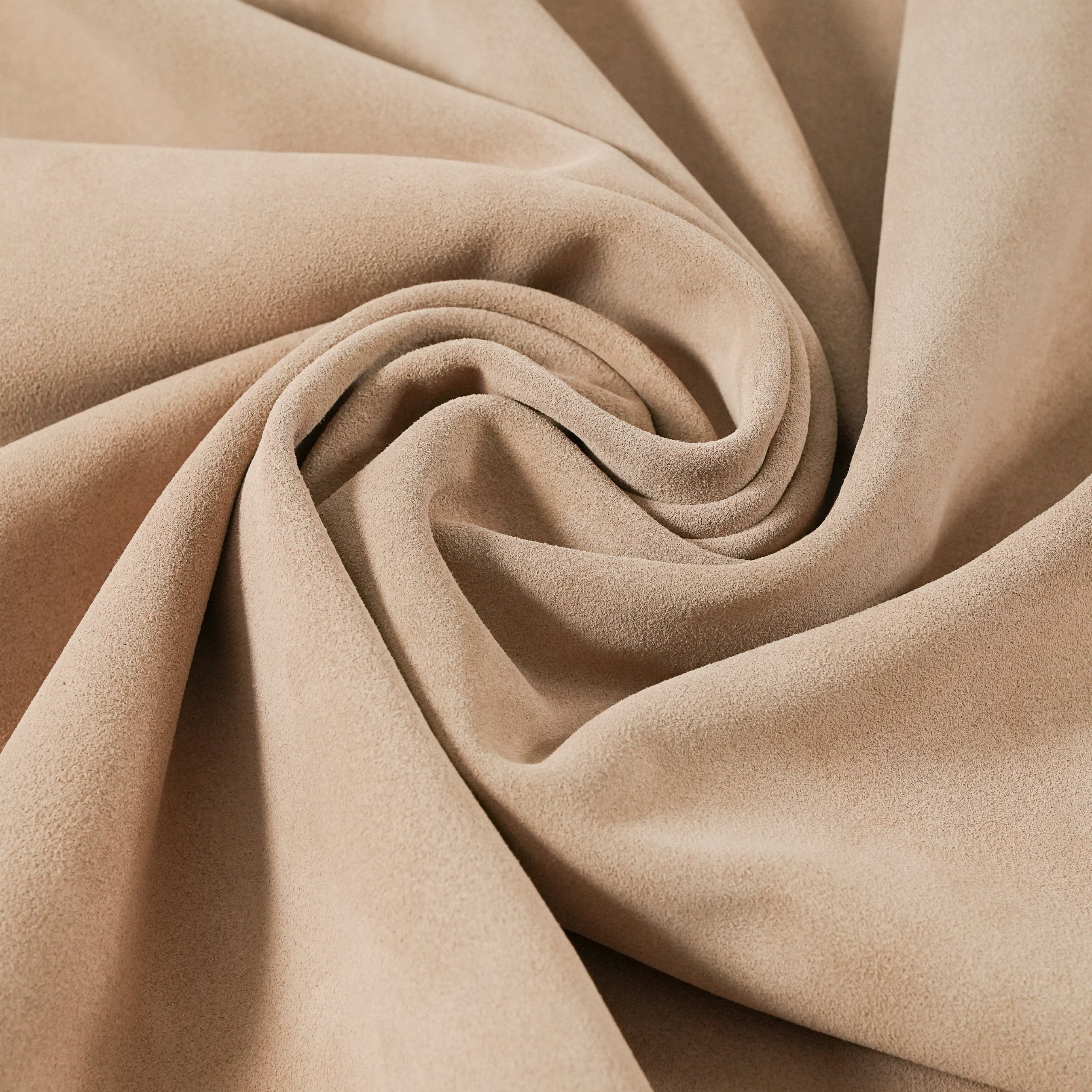 cowhide suede leather beige close-up flat lay texture