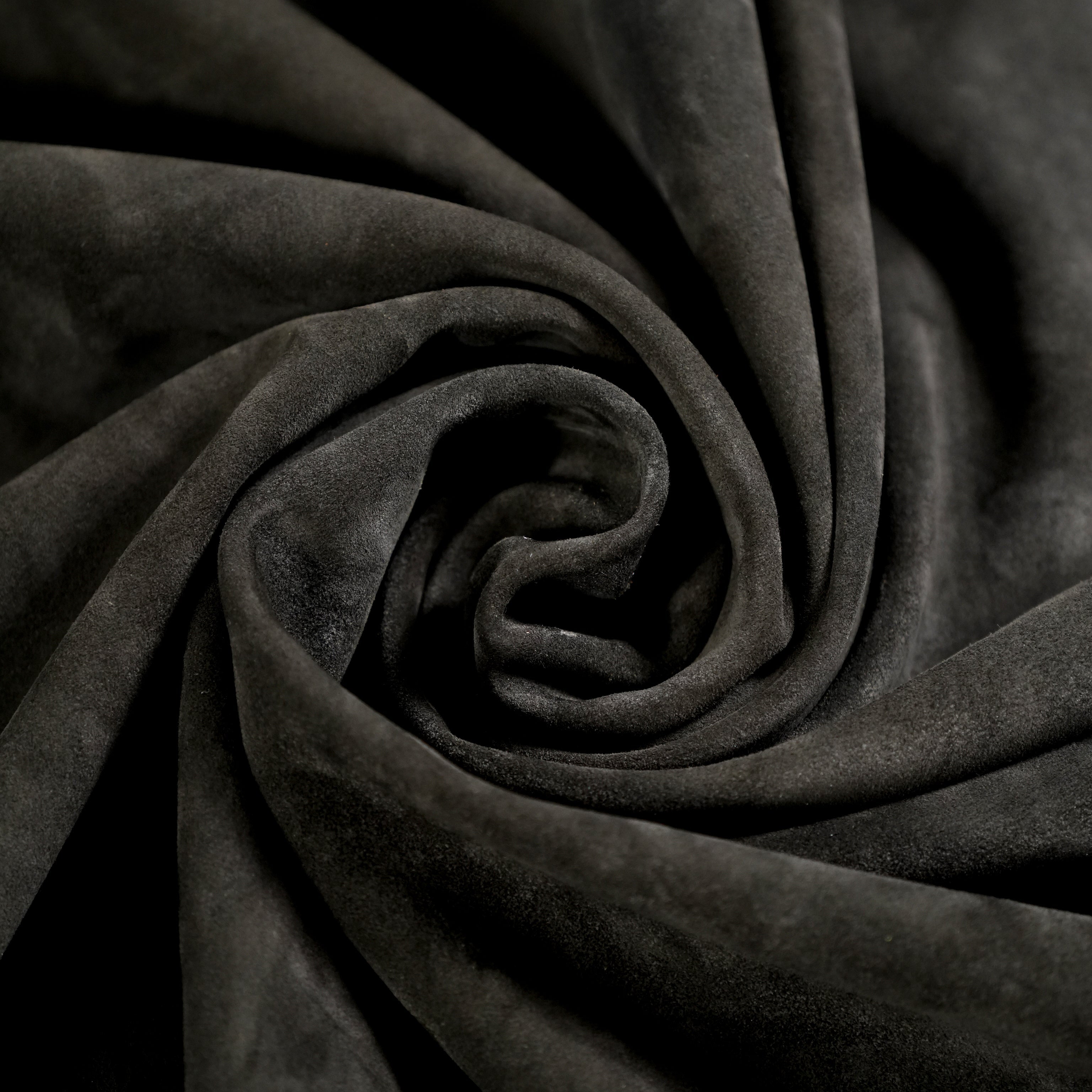 cowhide suede leather black close-up flat lay texture