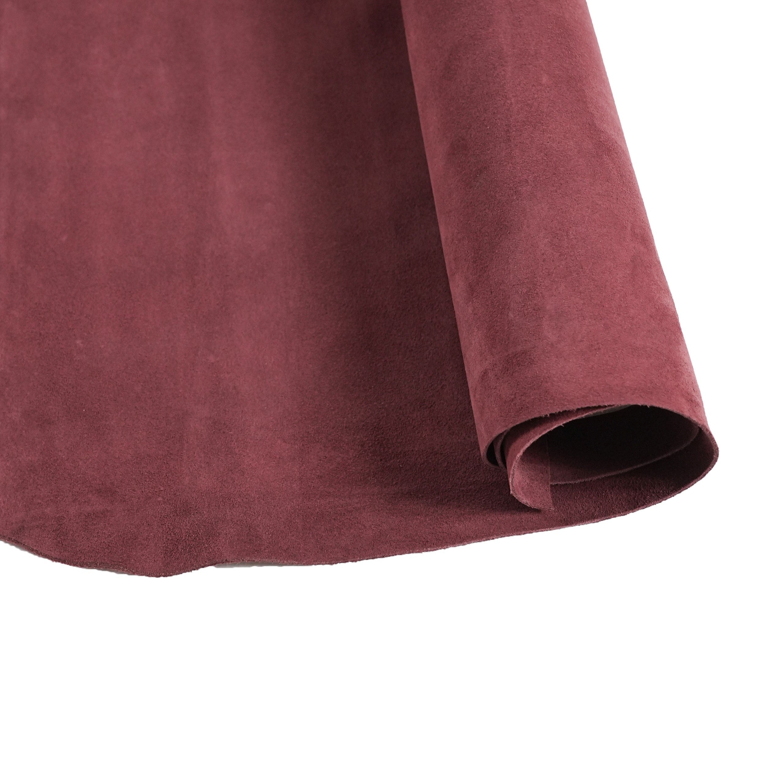 cowhide suede leather burgundy draped in natural light