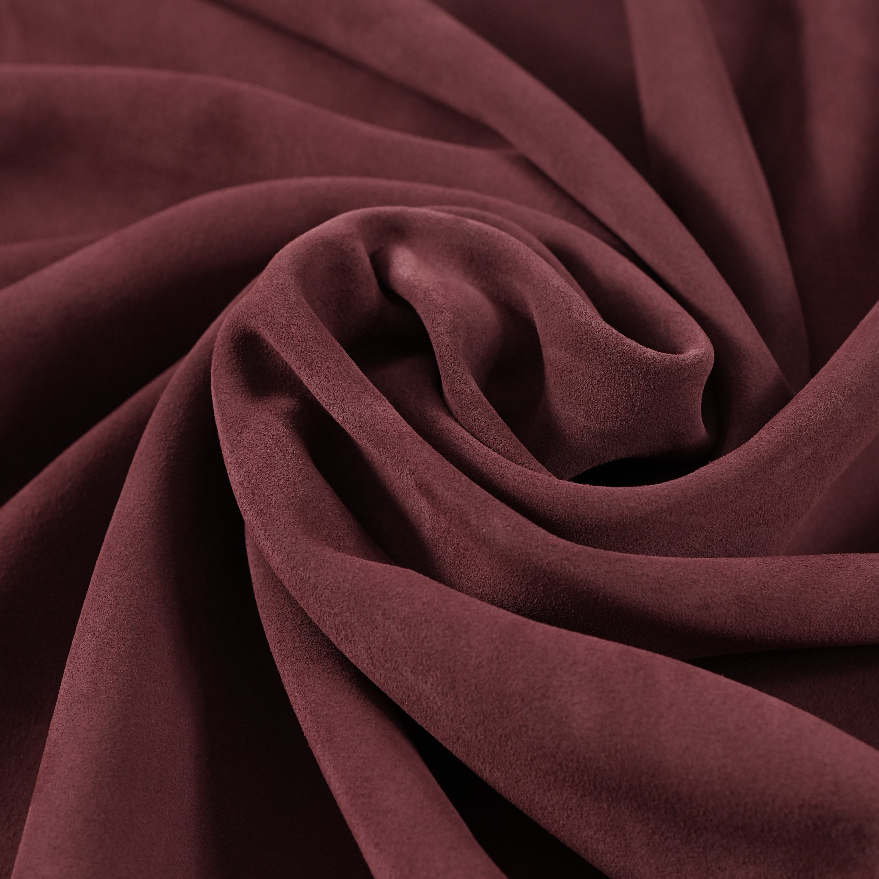 cowhide suede leather burgundy close-up flat lay texture