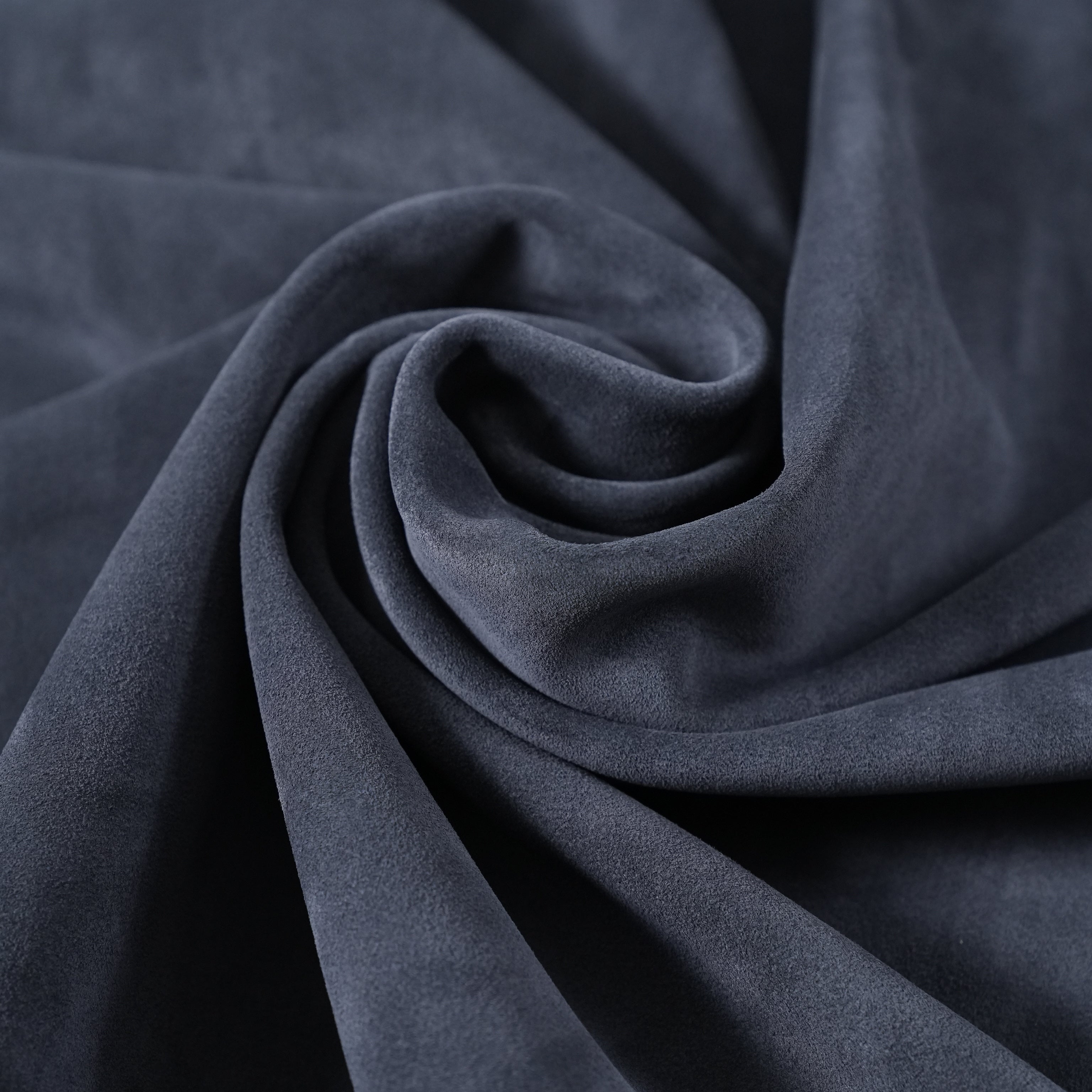 cowhide suede leather navy blue close-up flat lay texture