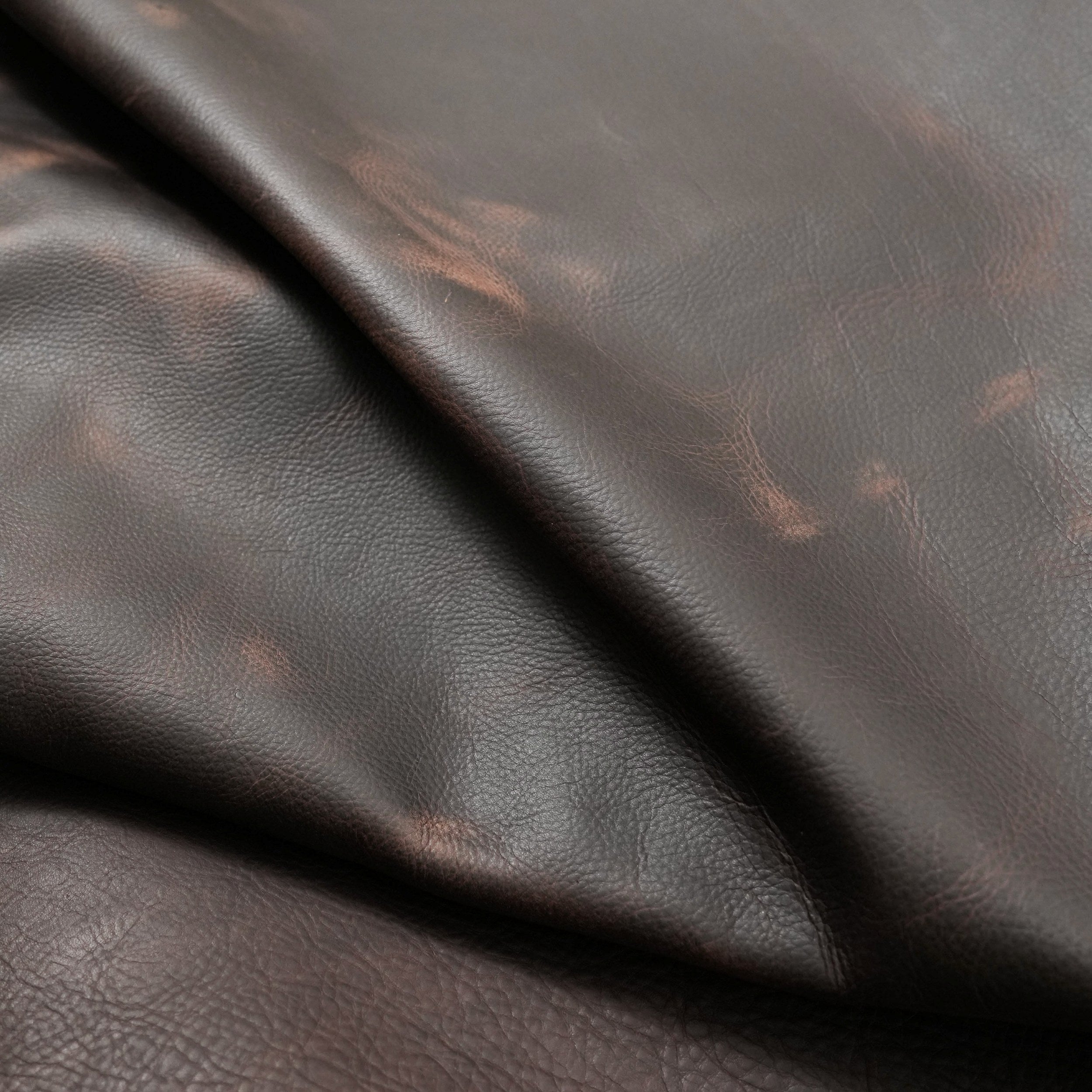 full grain pull up leather brown vintage distressed look close up