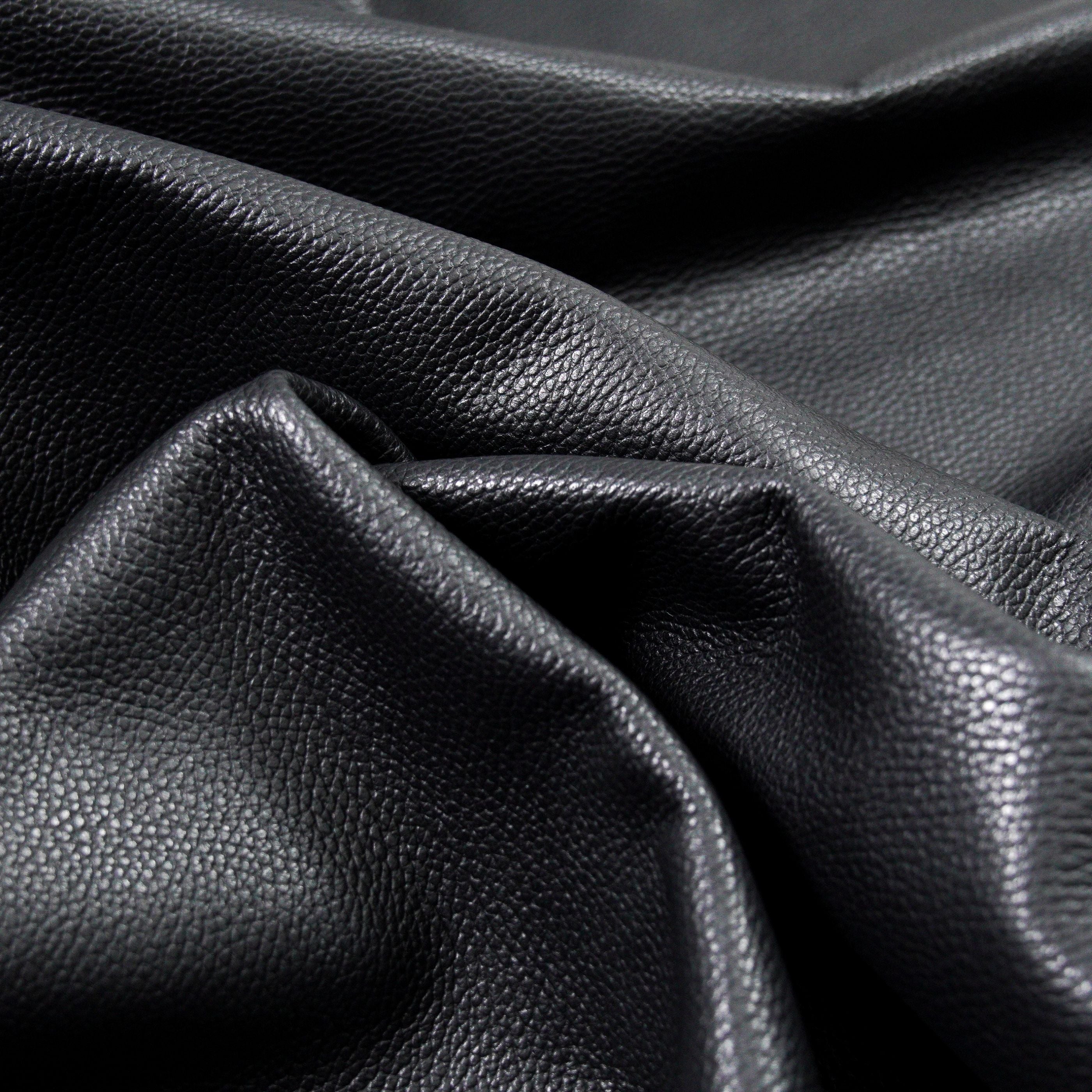 italian pebble grain cowhide leather surface detail black close up