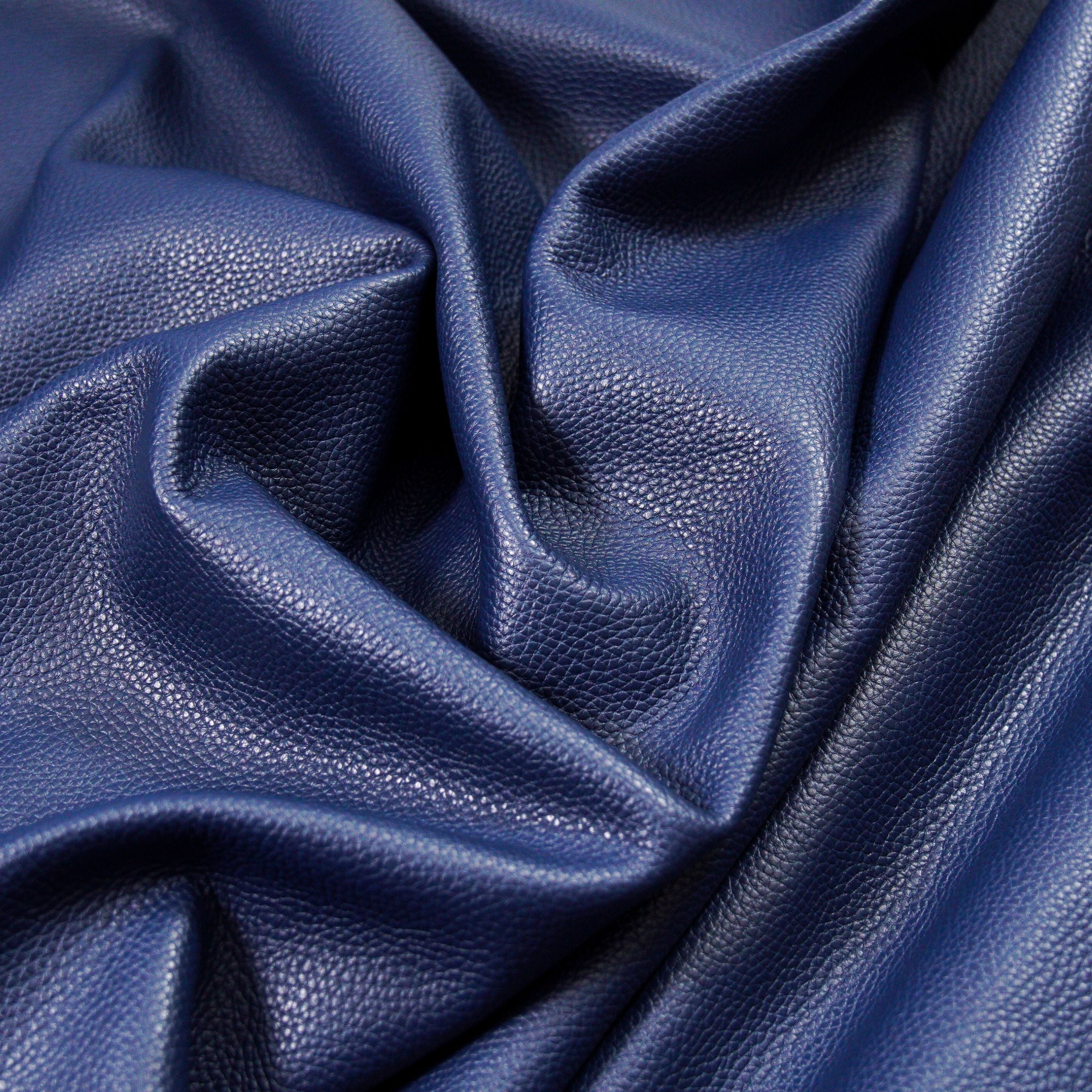 italian pebble grain cowhide leather surface detail navy blue close up