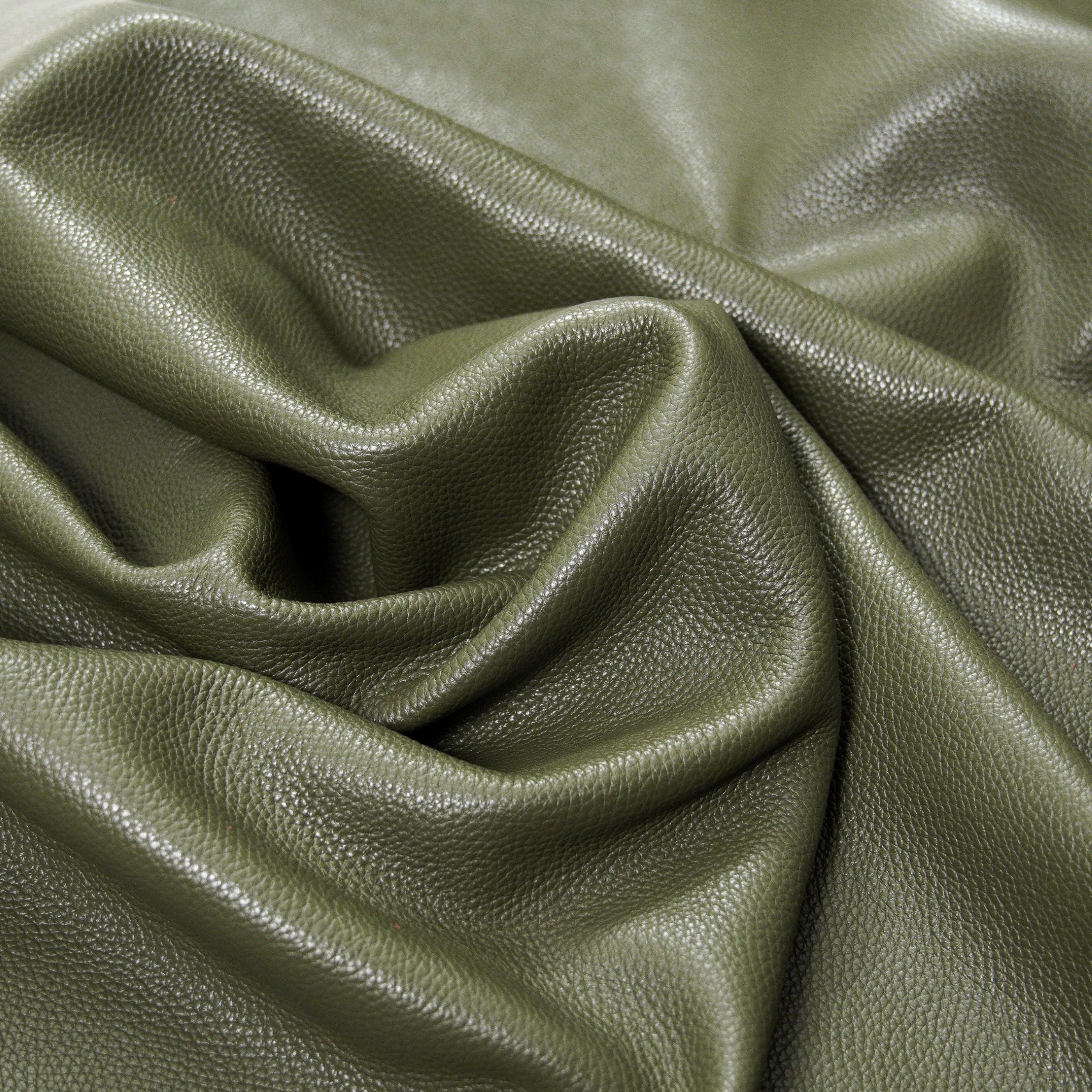 italian pebble grain cowhide leather surface detail olive green close up