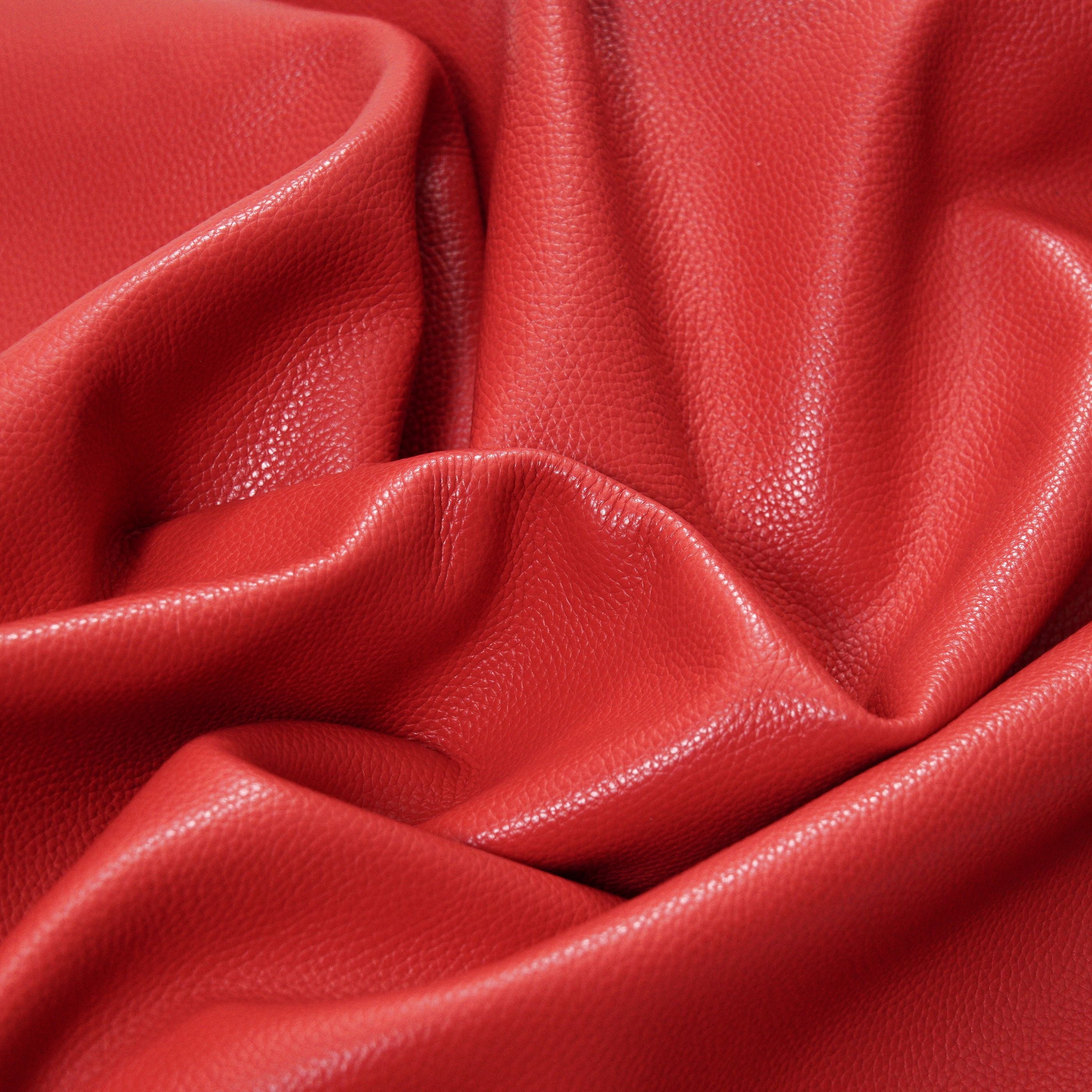 italian pebble grain cowhide leather surface detail red close up