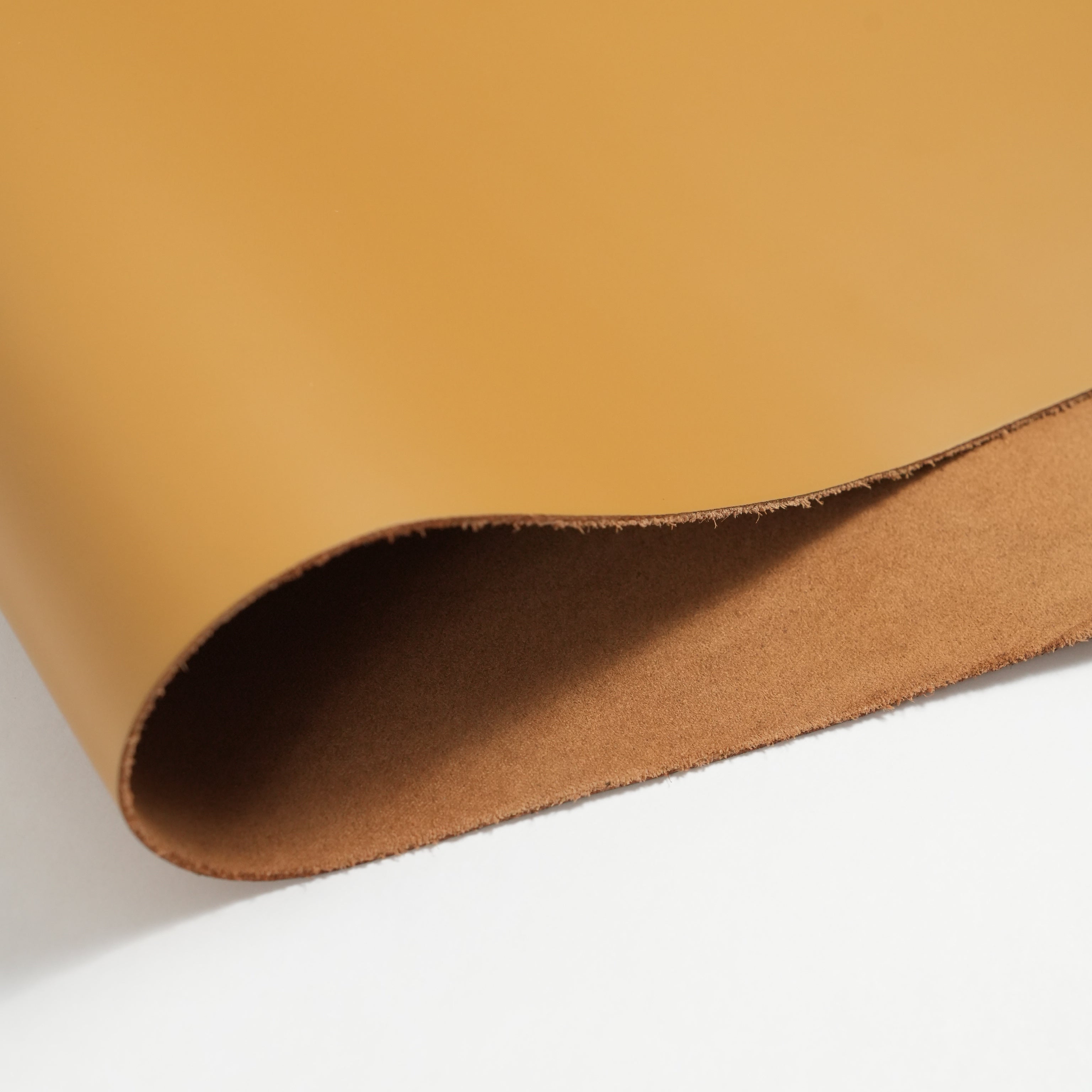 italian smooth leather sides mustard yellow folded sheet edge detail