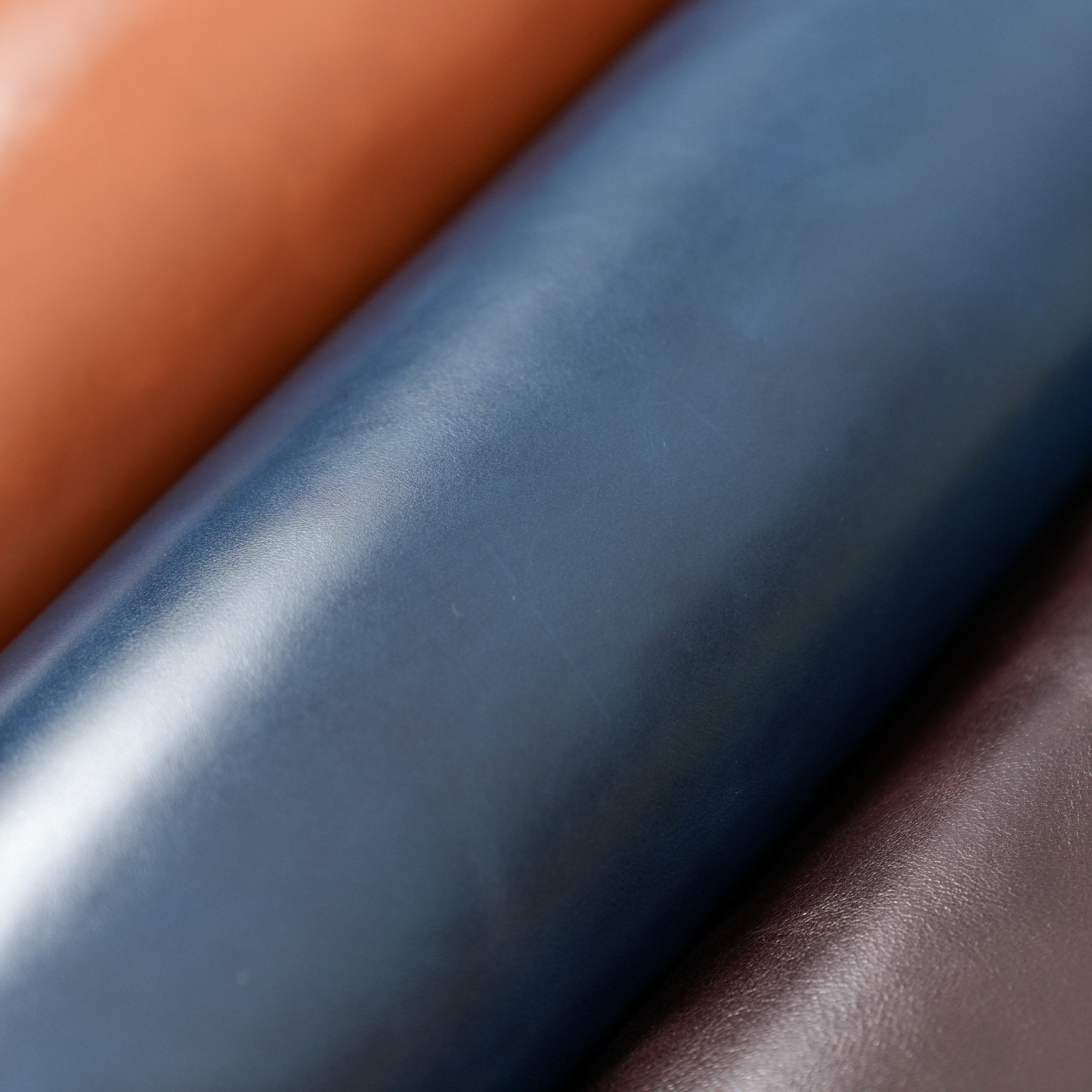 italian top grain glazed leather close up navy blue