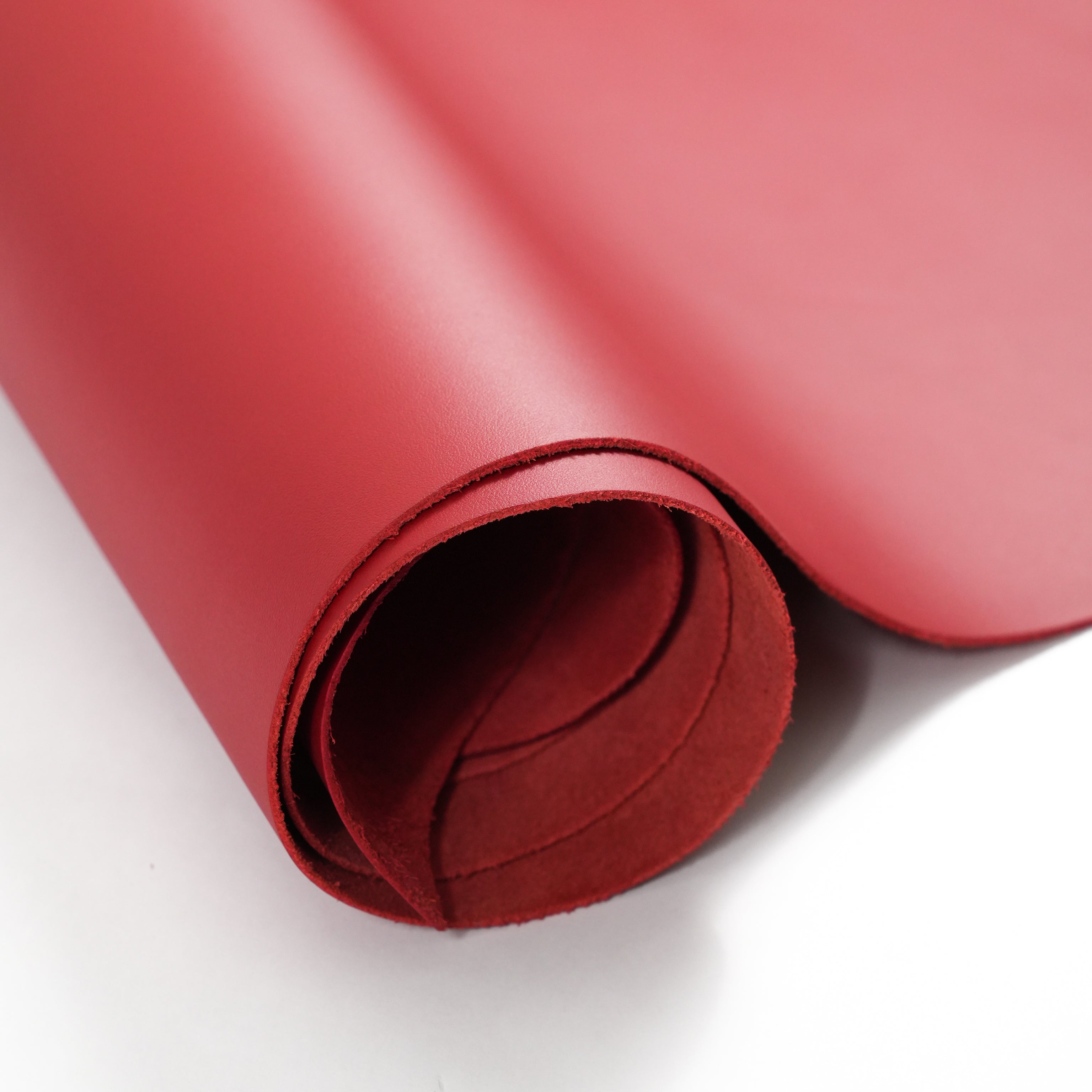 red top-grain premium italian leather partially unrolled view