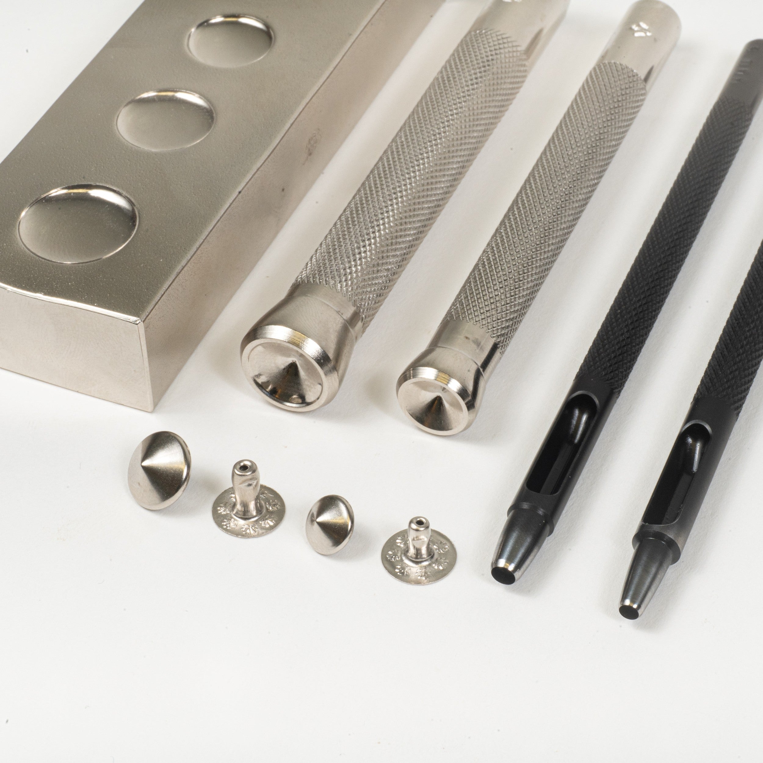 spike rivet setter with anvil and round drive punch close up