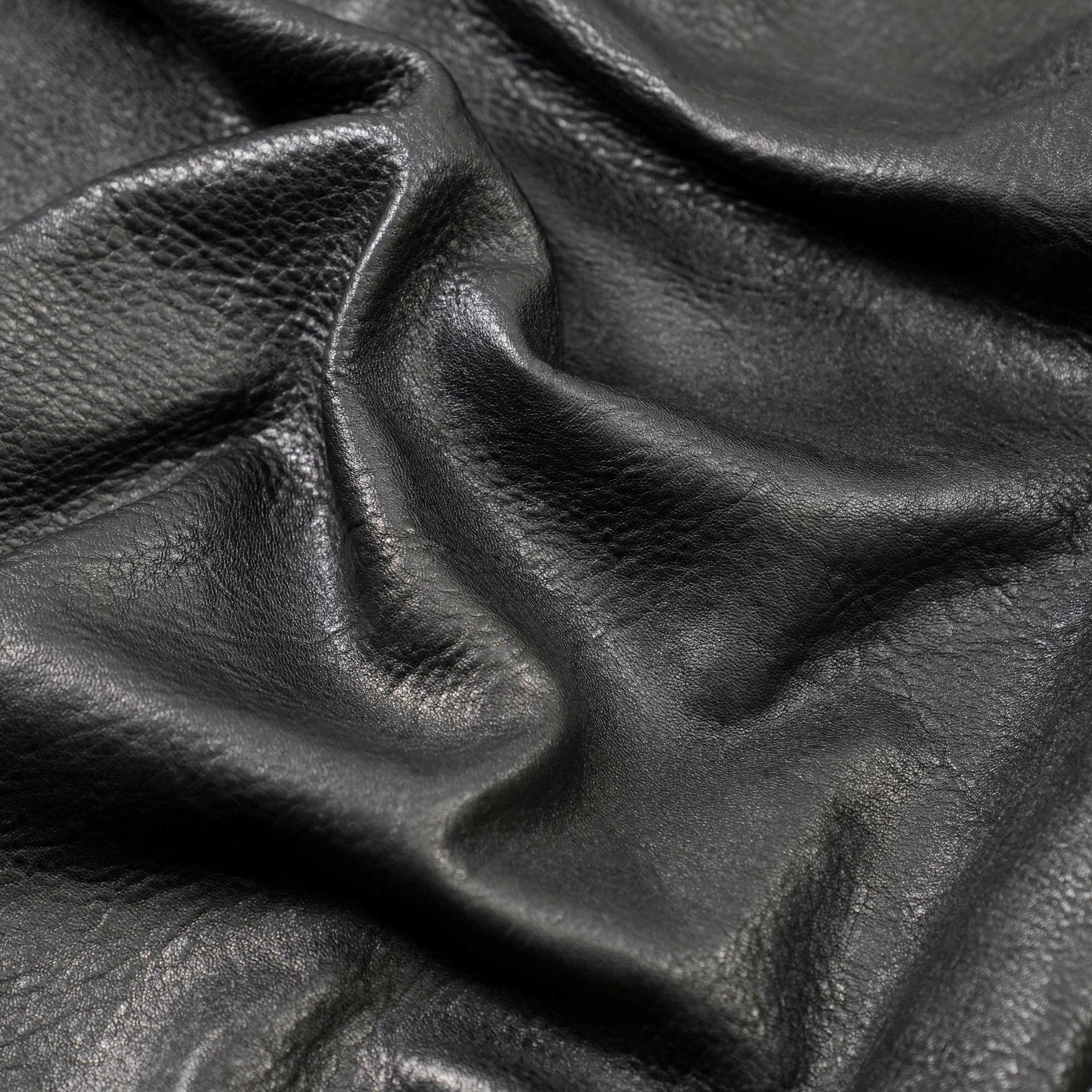 veg tan lambskin leather washed close up view black