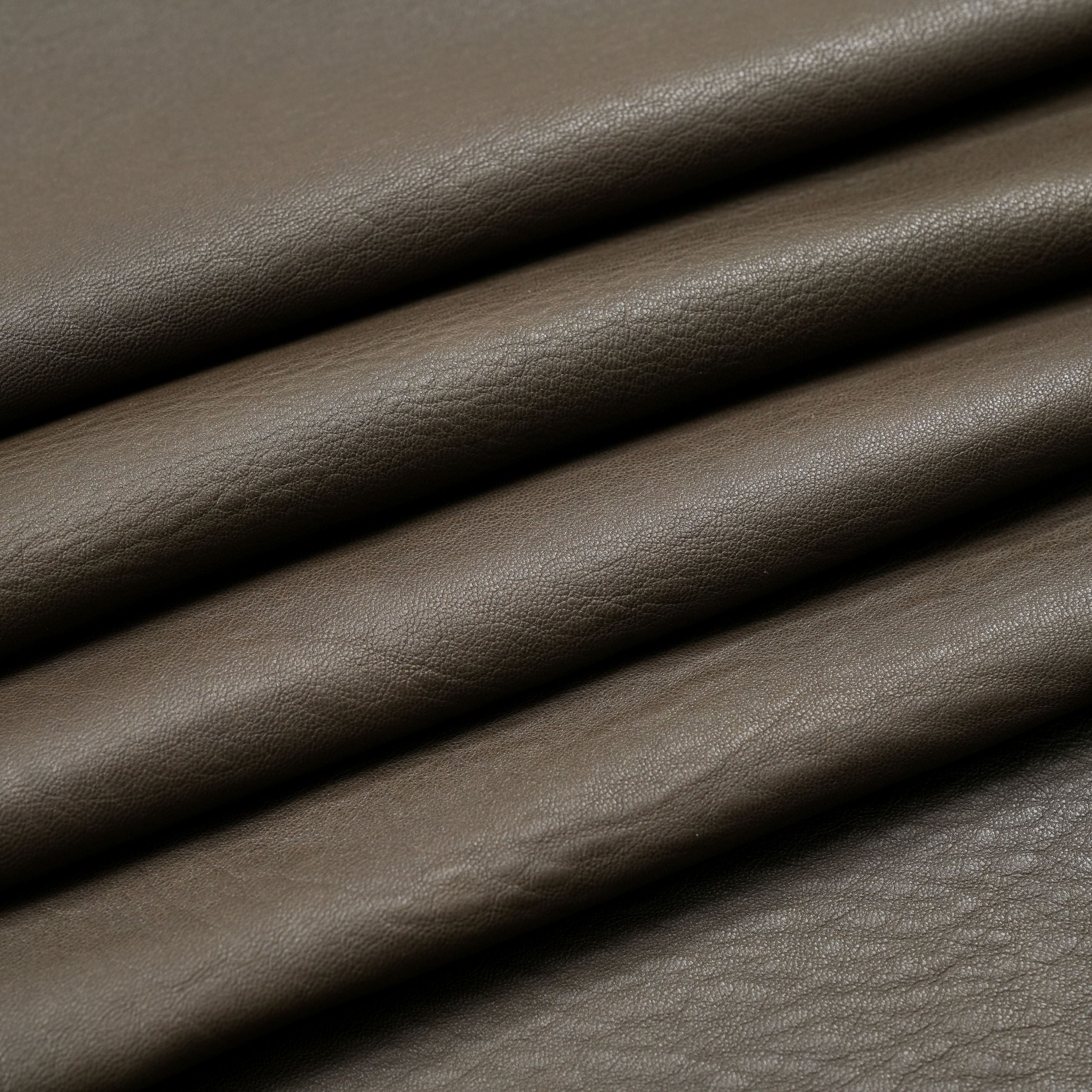 veg tan lambskin leather washed close up view khaki green