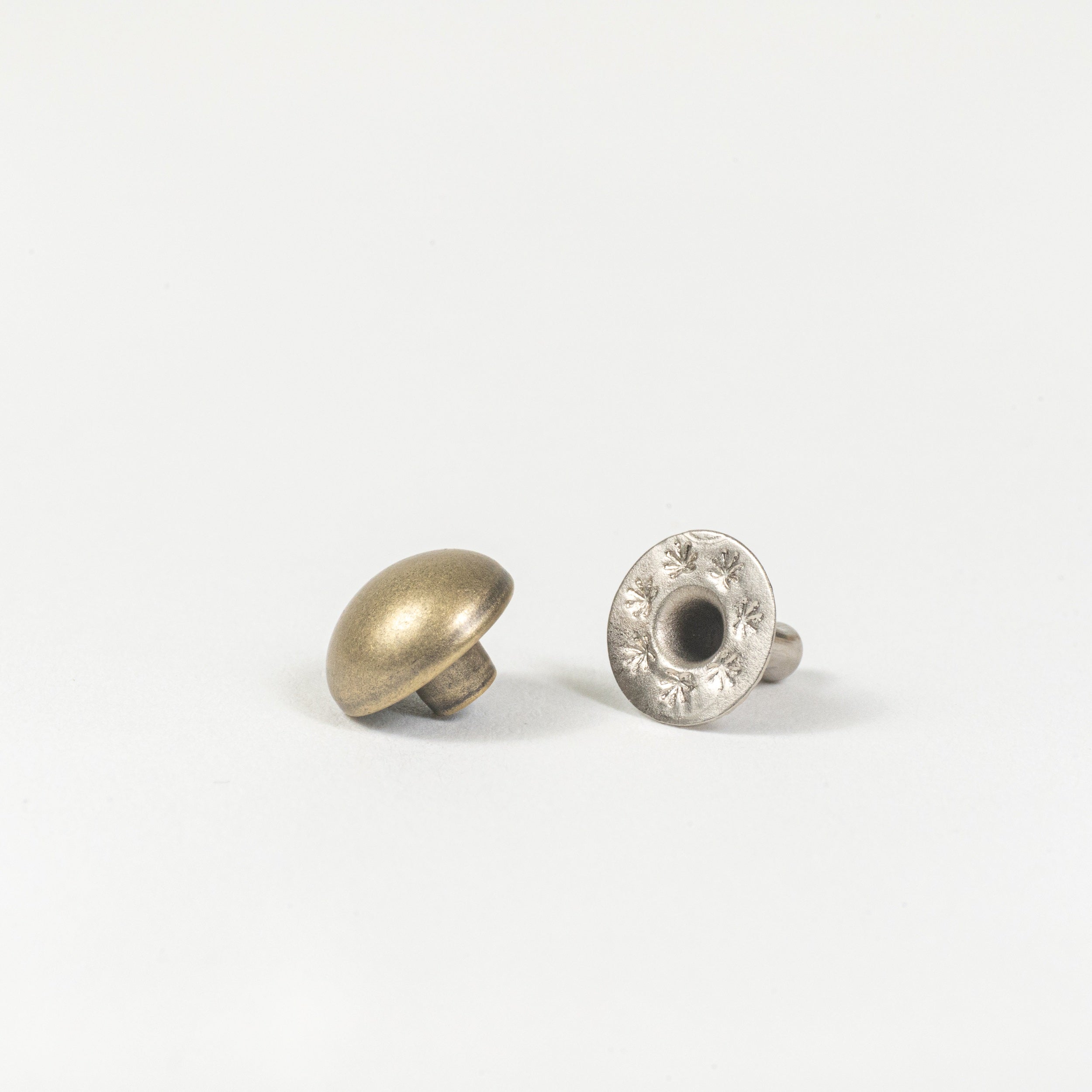 antique brass domed rivet angle view