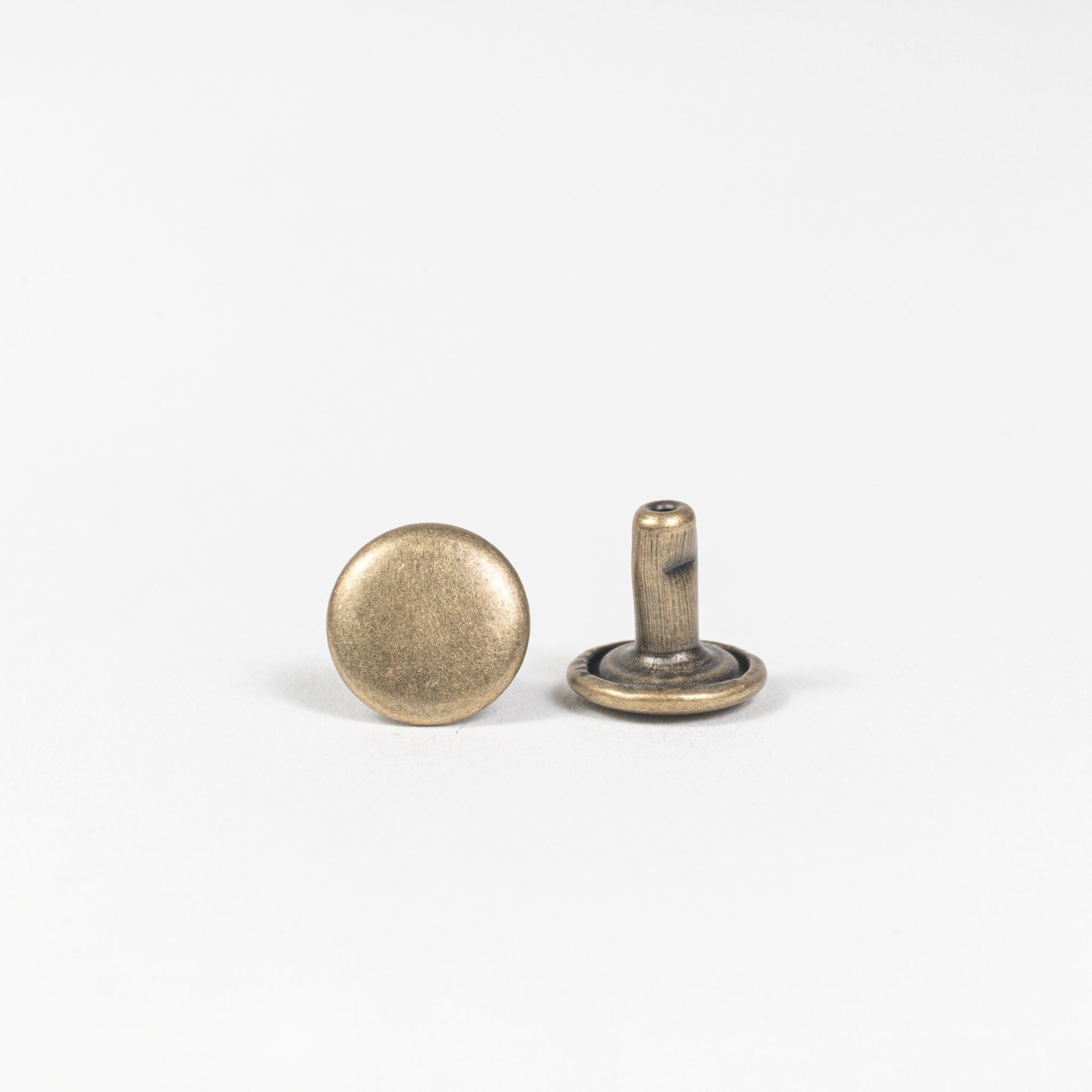 antique brass double cap rivet front and post view