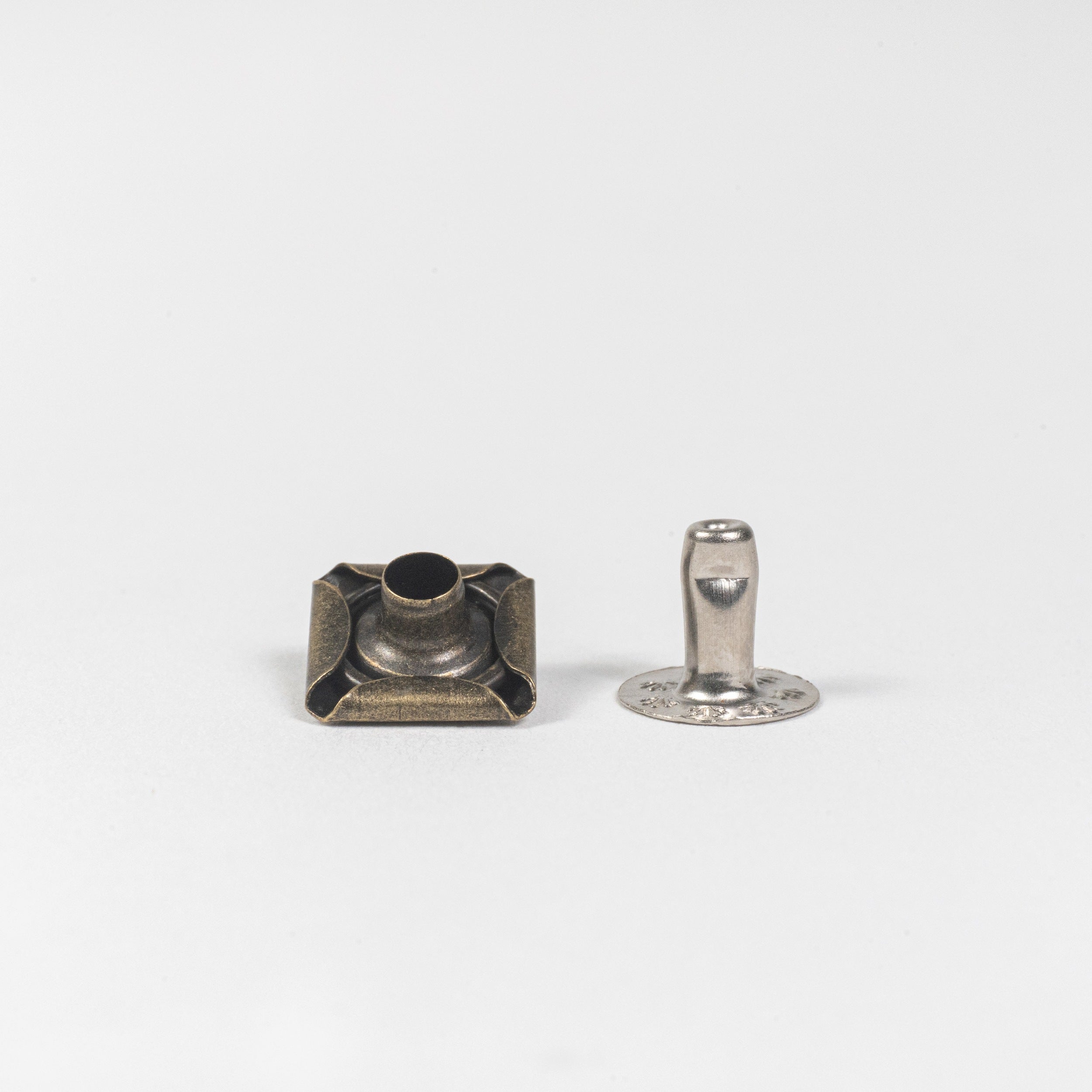 antique brass pyramid rivet front view