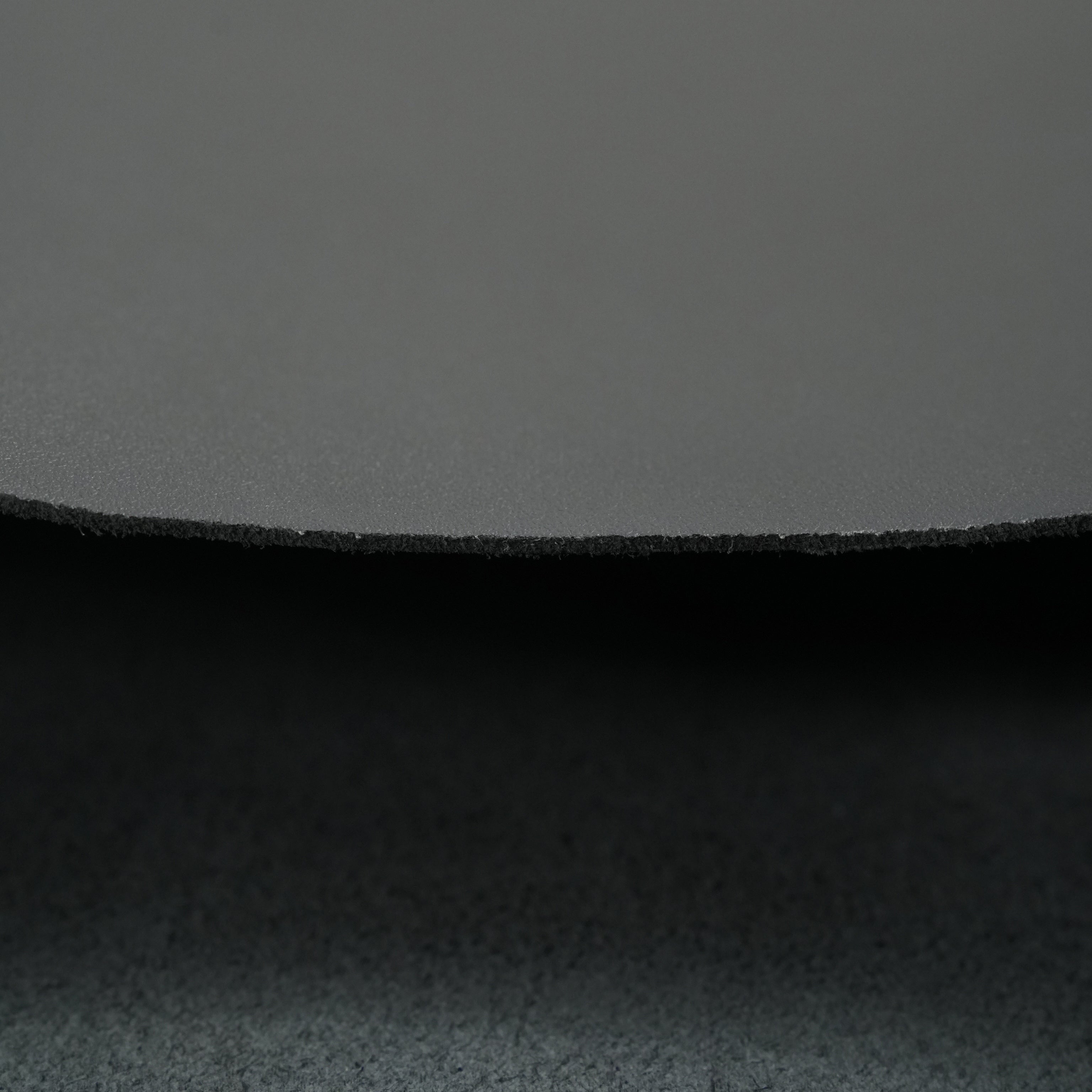 black top-grain premium italian leather edge close up view