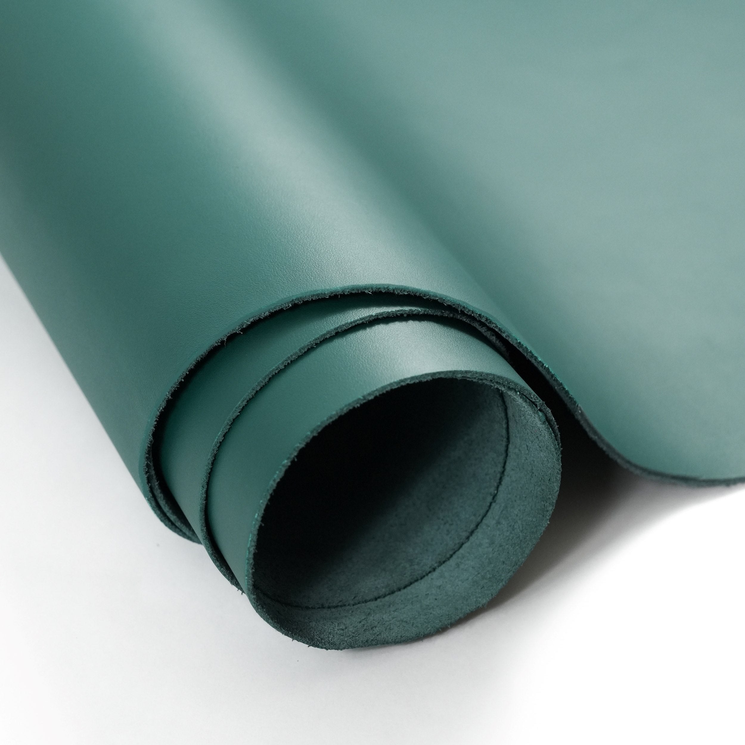 green top-grain premium italian leather partially unrolled view
