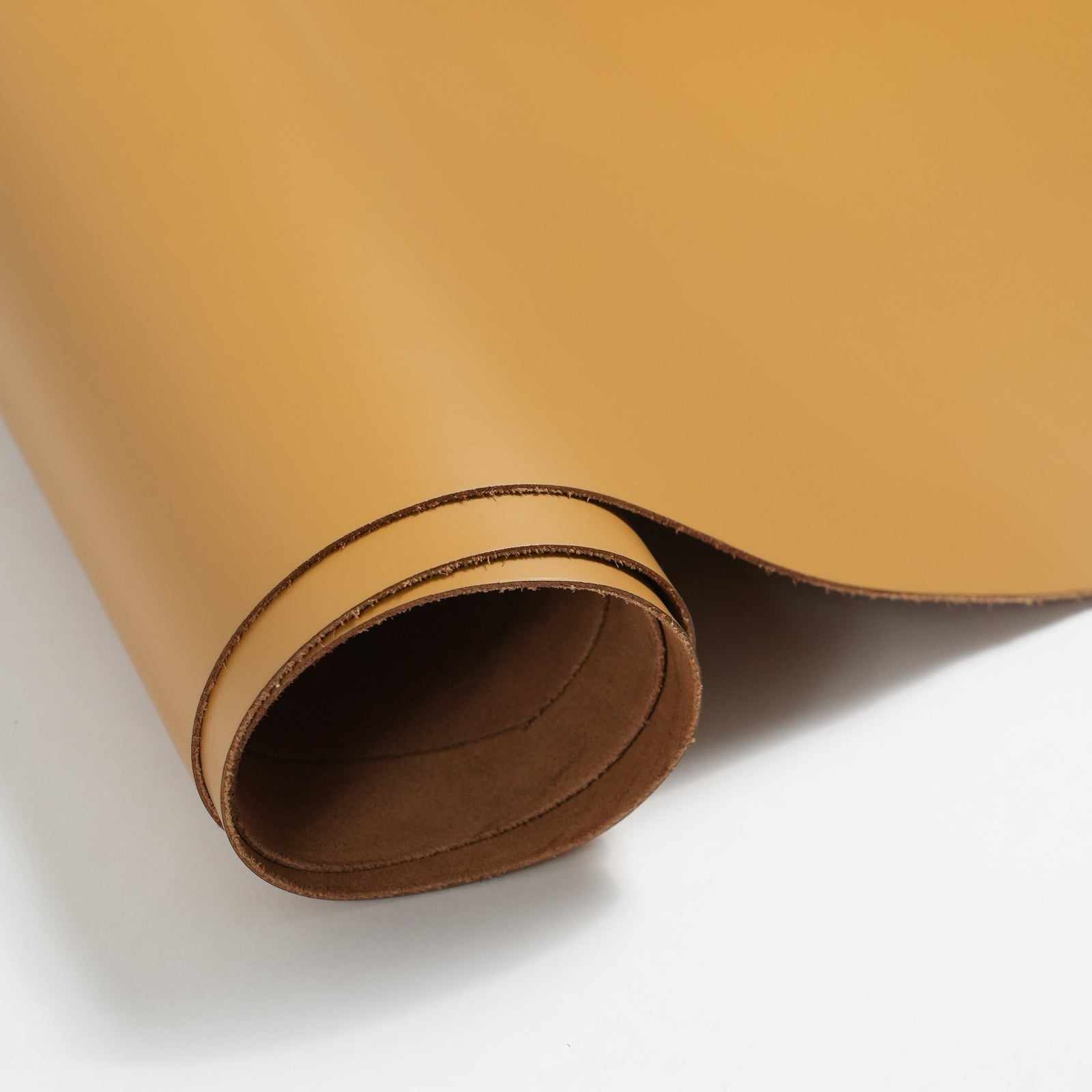 italian smooth leather sides mustard yellow close-up flat lay texture