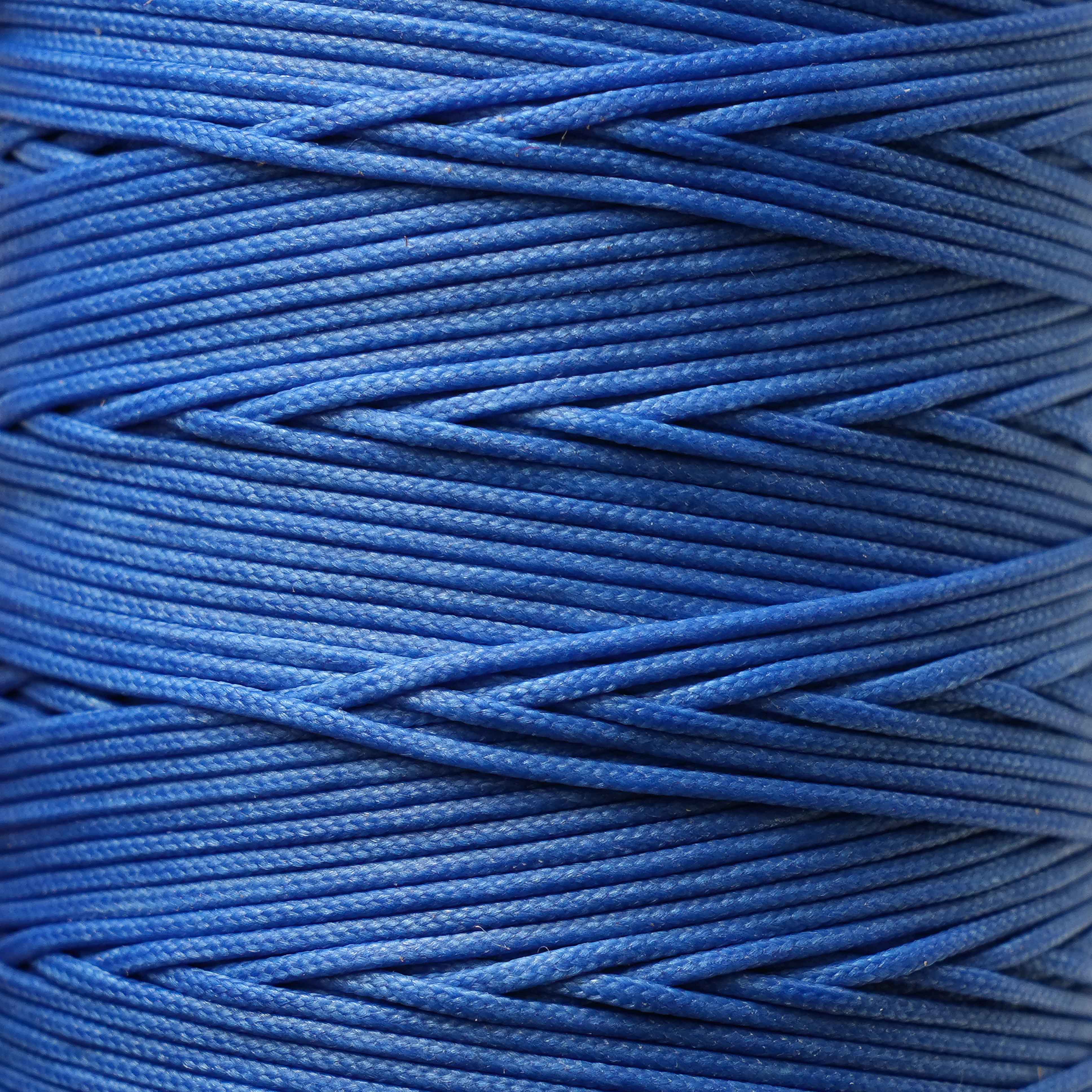 Close-up of a spool of blue thread