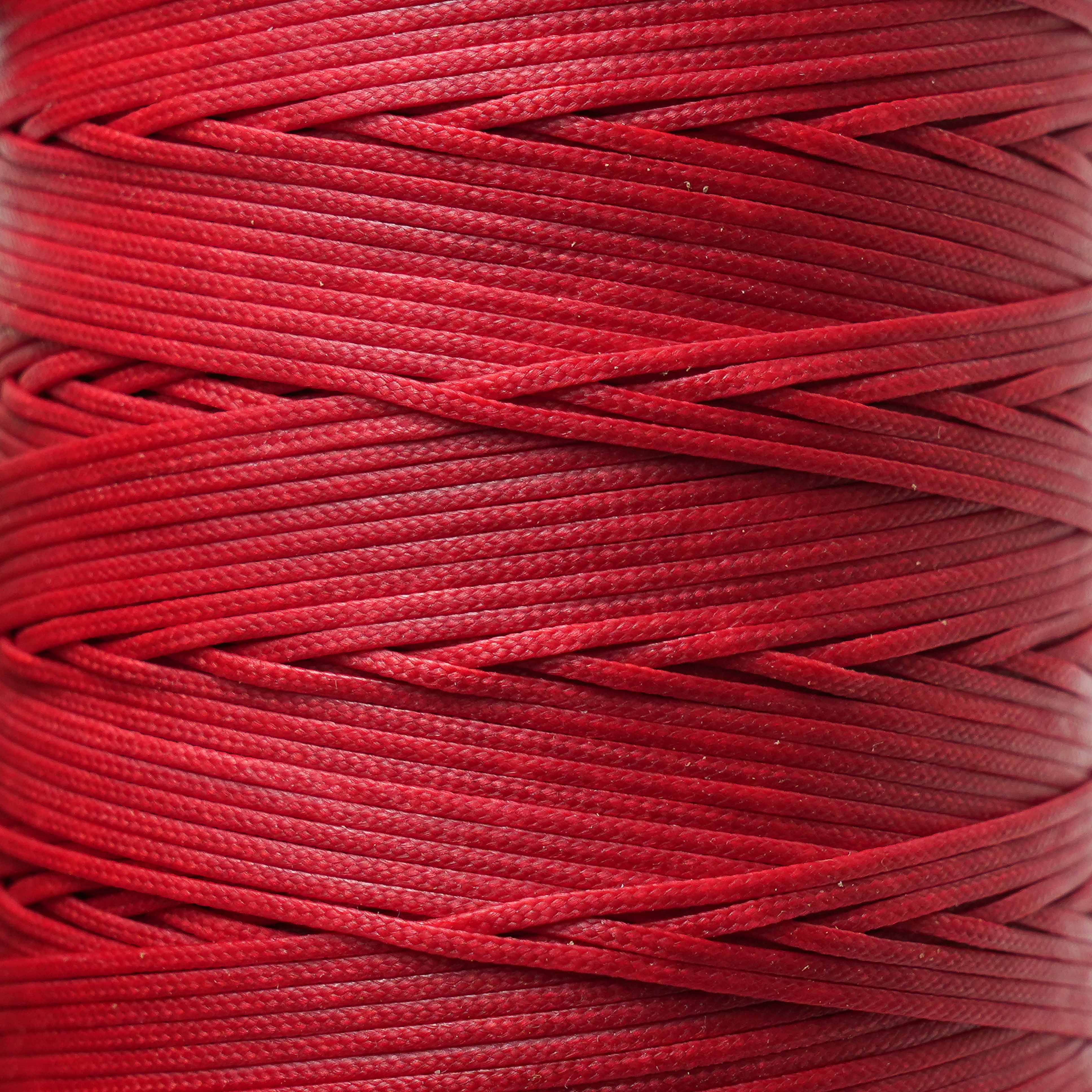 Close-up of a spool of crimson red cord
