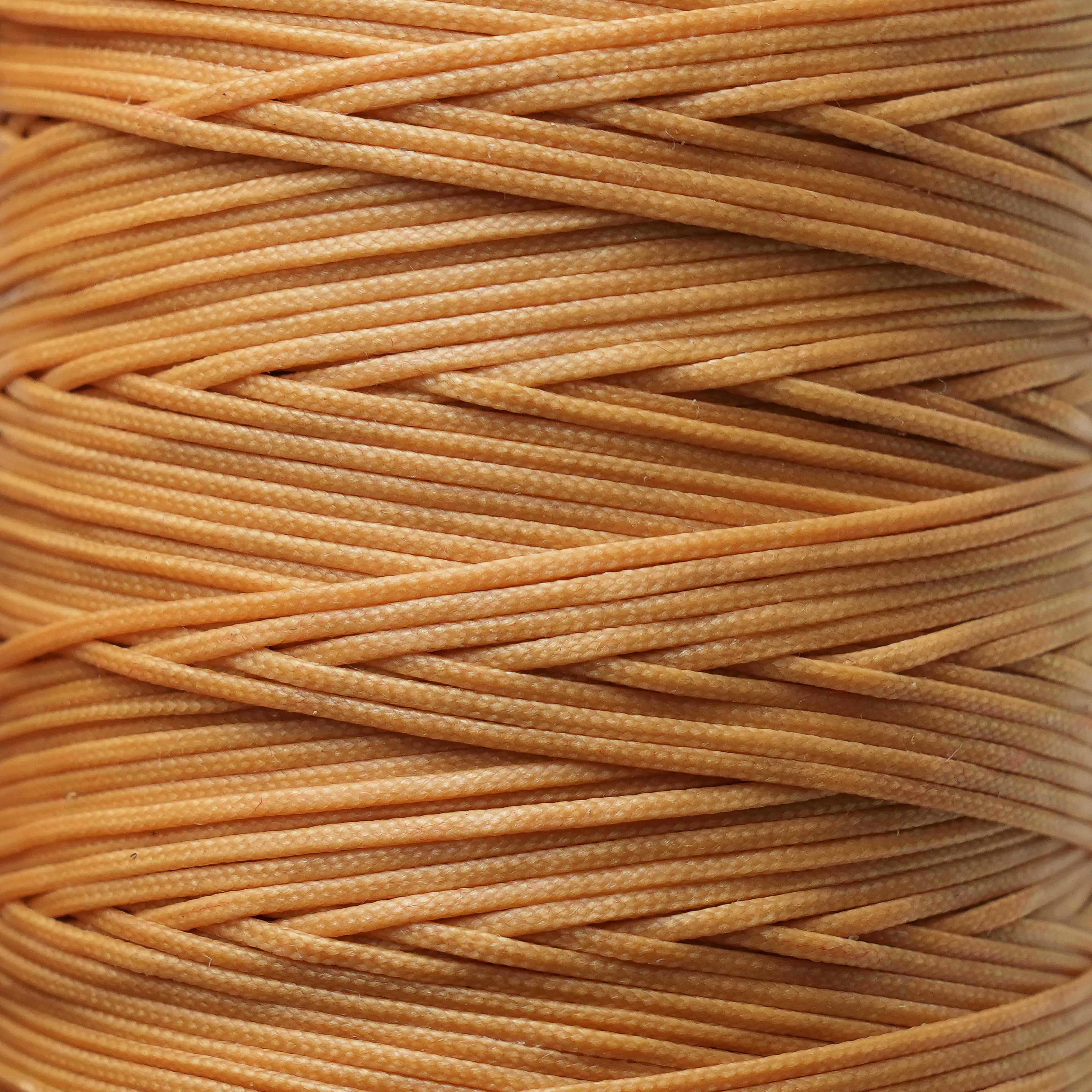 Close-up of a spool of Ochre thread