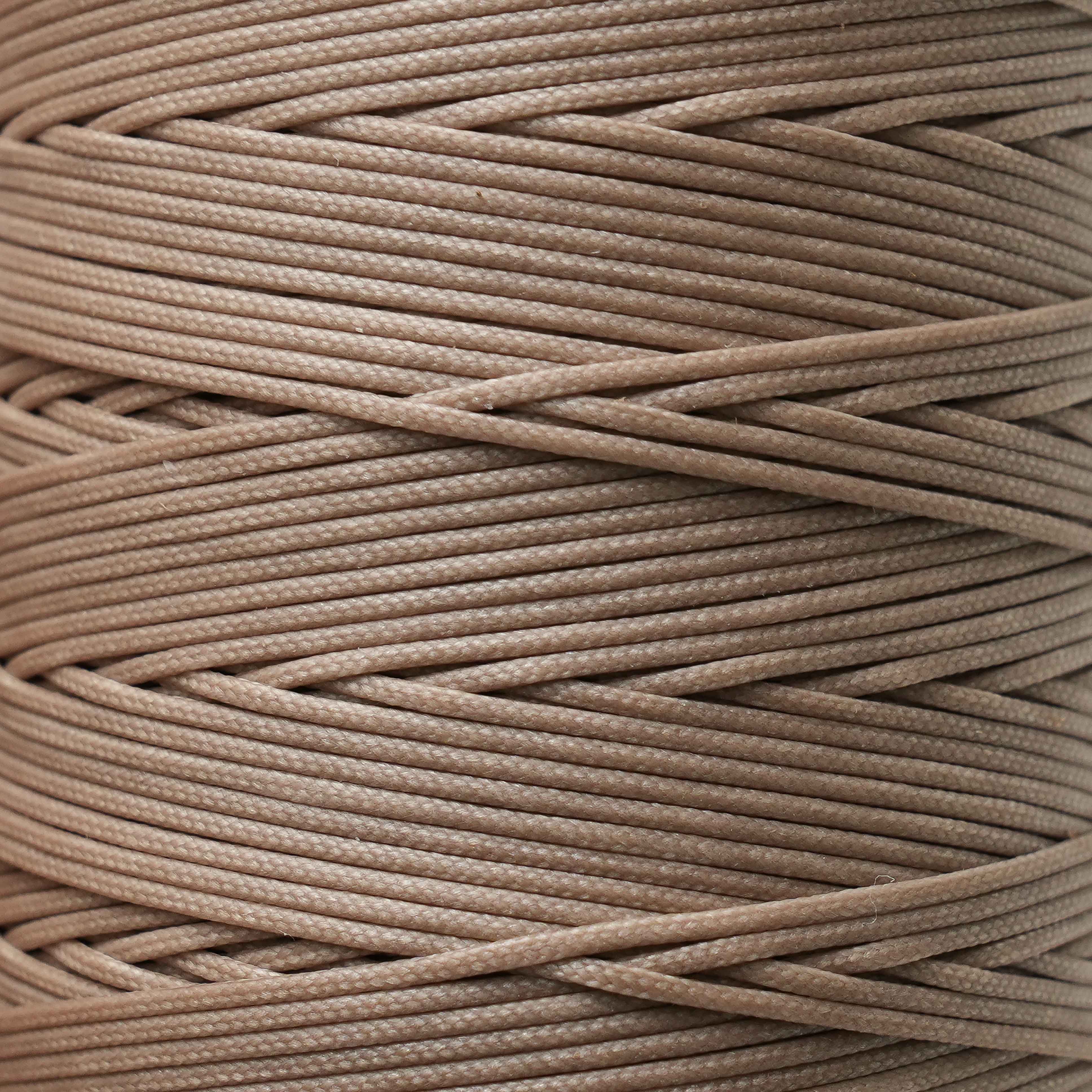Close-up of a spool of sandstone thread
