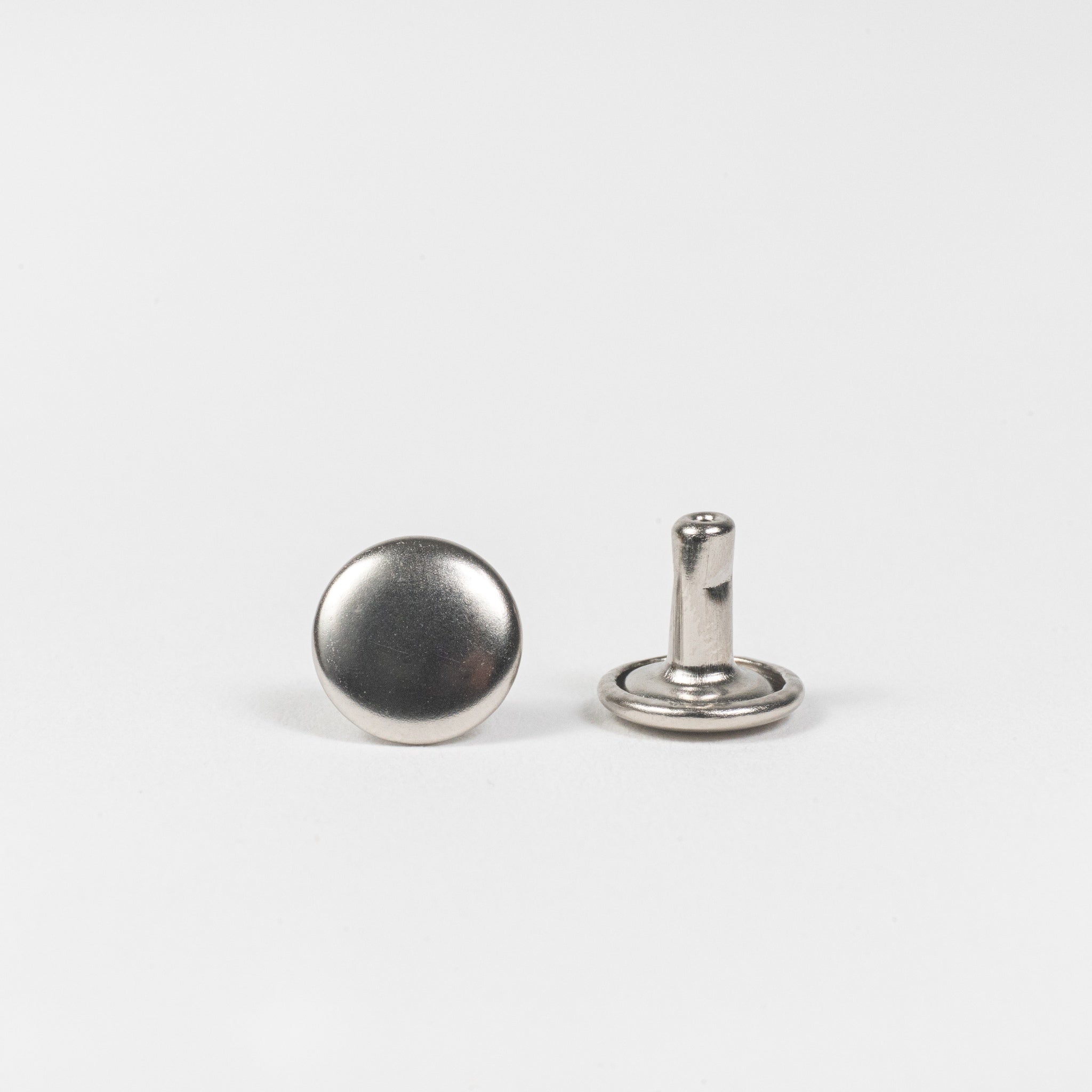 nickel plated double cap rivet front and post view
