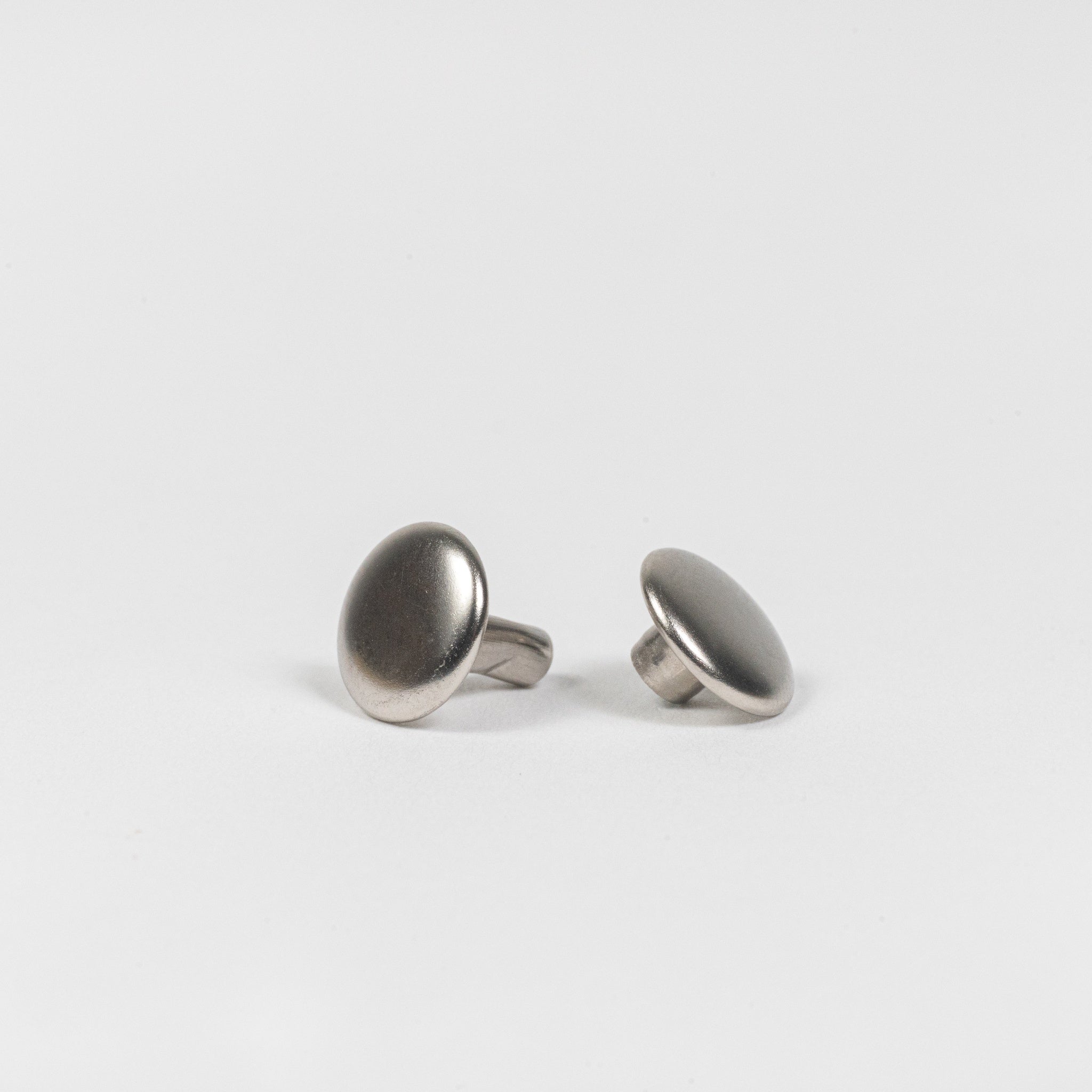nickel plated double cap rivets side angle view