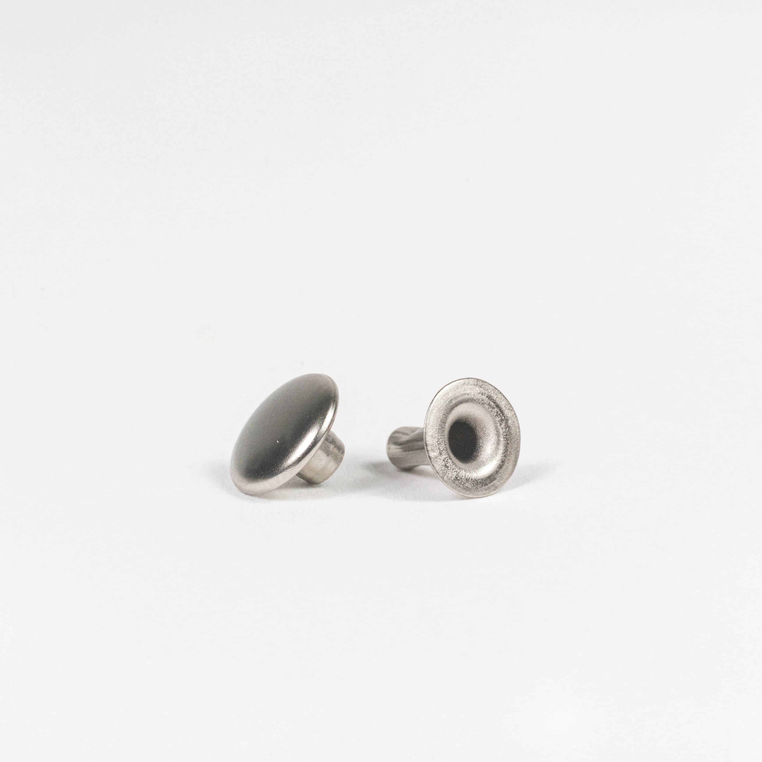nickel plated rapid rivet side angle view