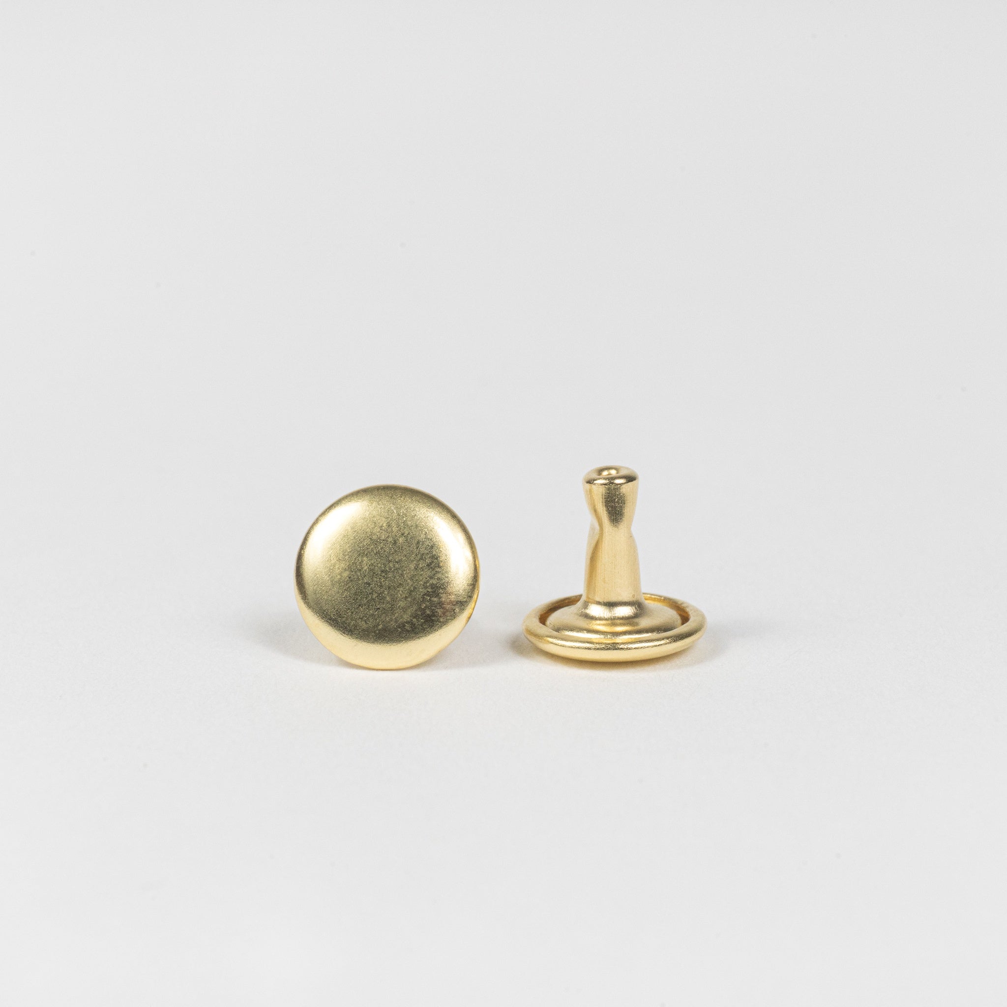 solid brass double cap rivet front and post view