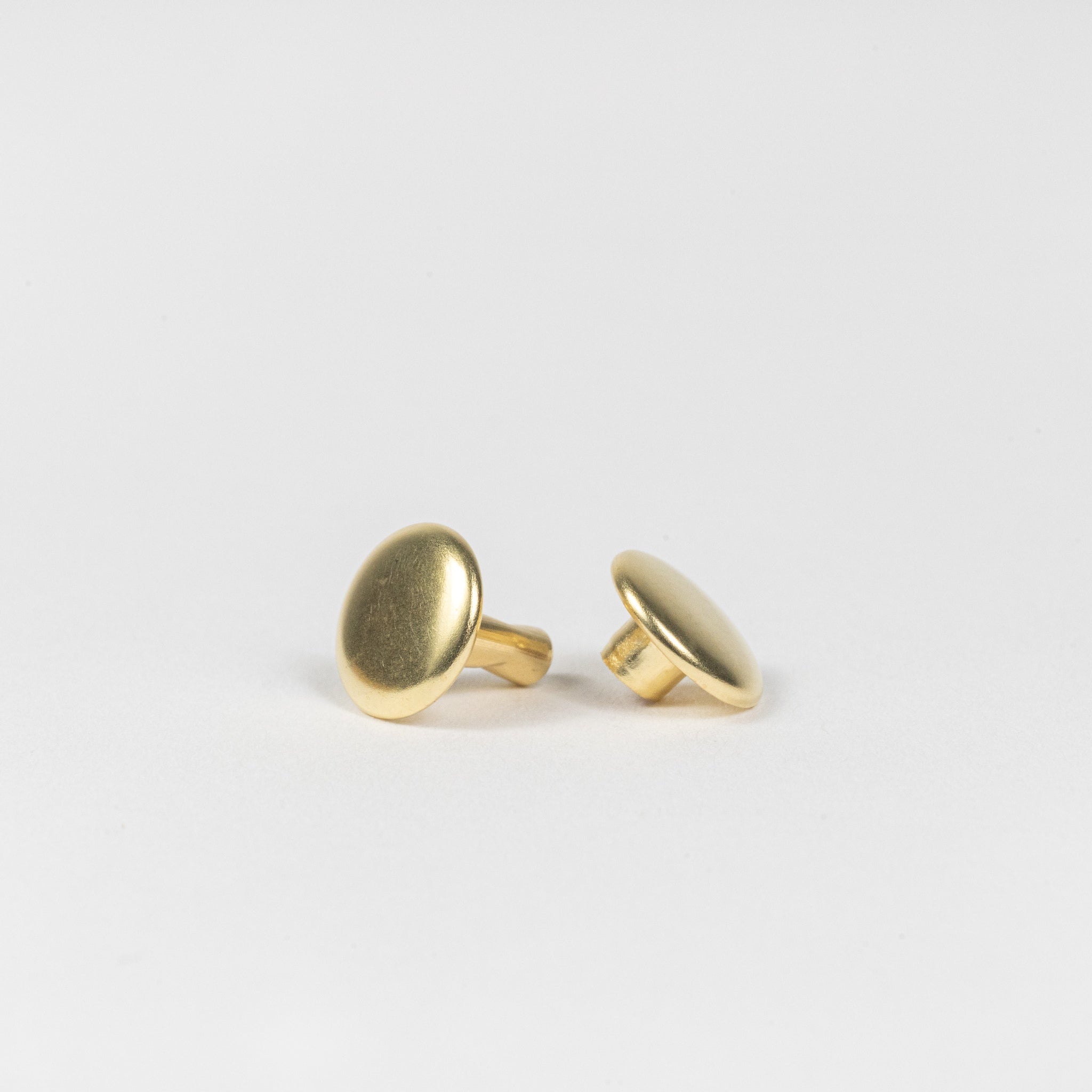 solid brass double cap rivets side angle view