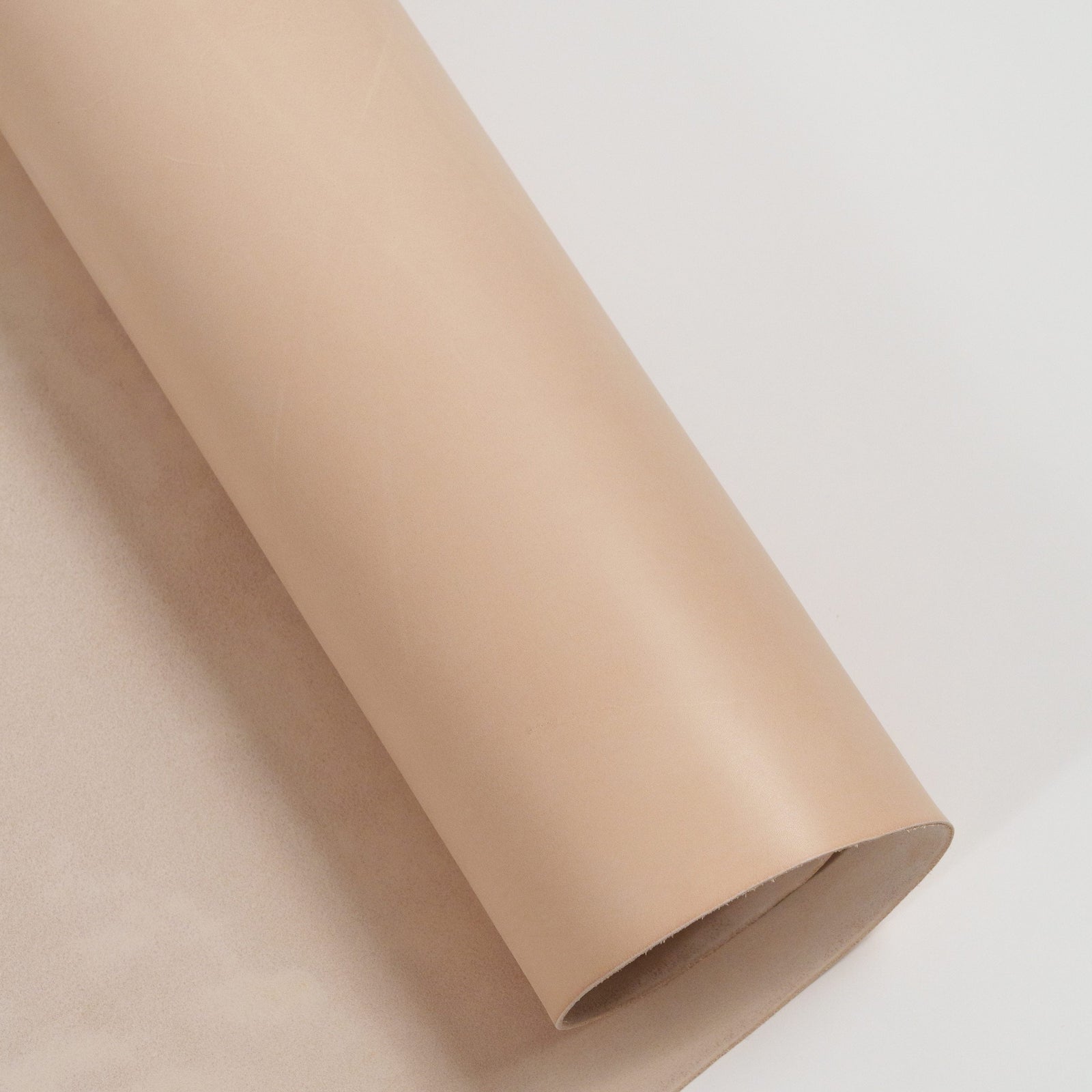 warm natural vachetta partially unrolled leather rolls